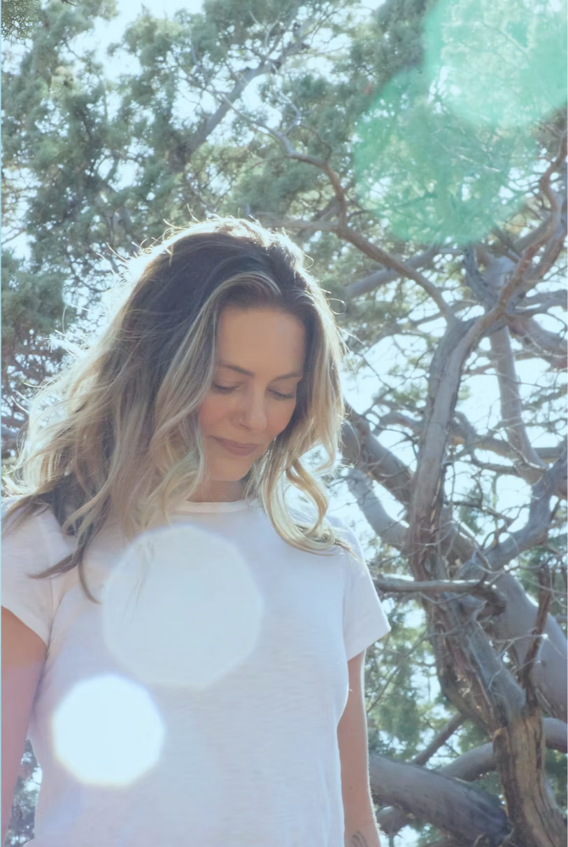 Liv Divine, founder of Earth + Sky, standing outdoors