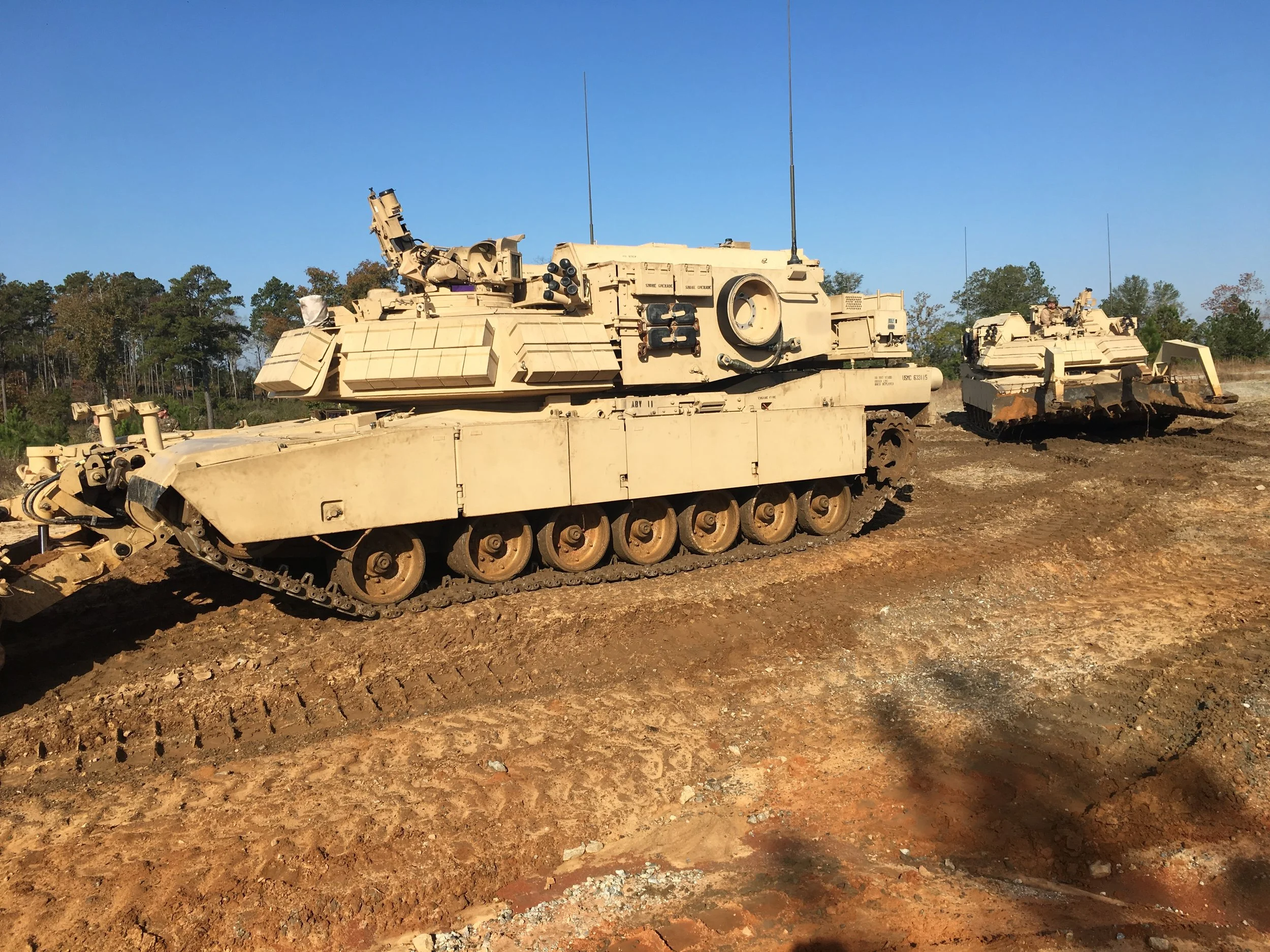 (2) Assault Breacher Vehicles postioned for their student drivers in the training environment. 