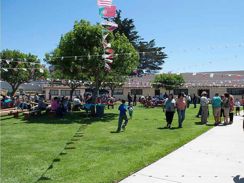 Grass courtyard event at the FDES Portuguese Hall of Monterey with guests and outdoor gathering space.