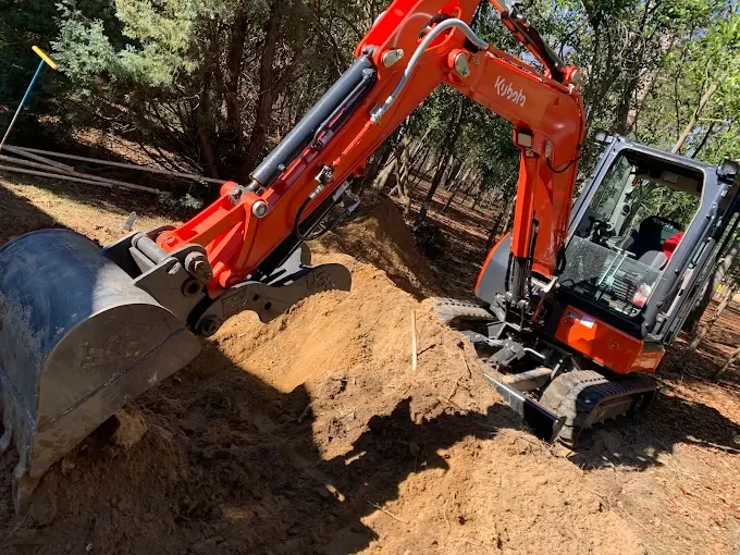 Excavating for a new septic tank replacement