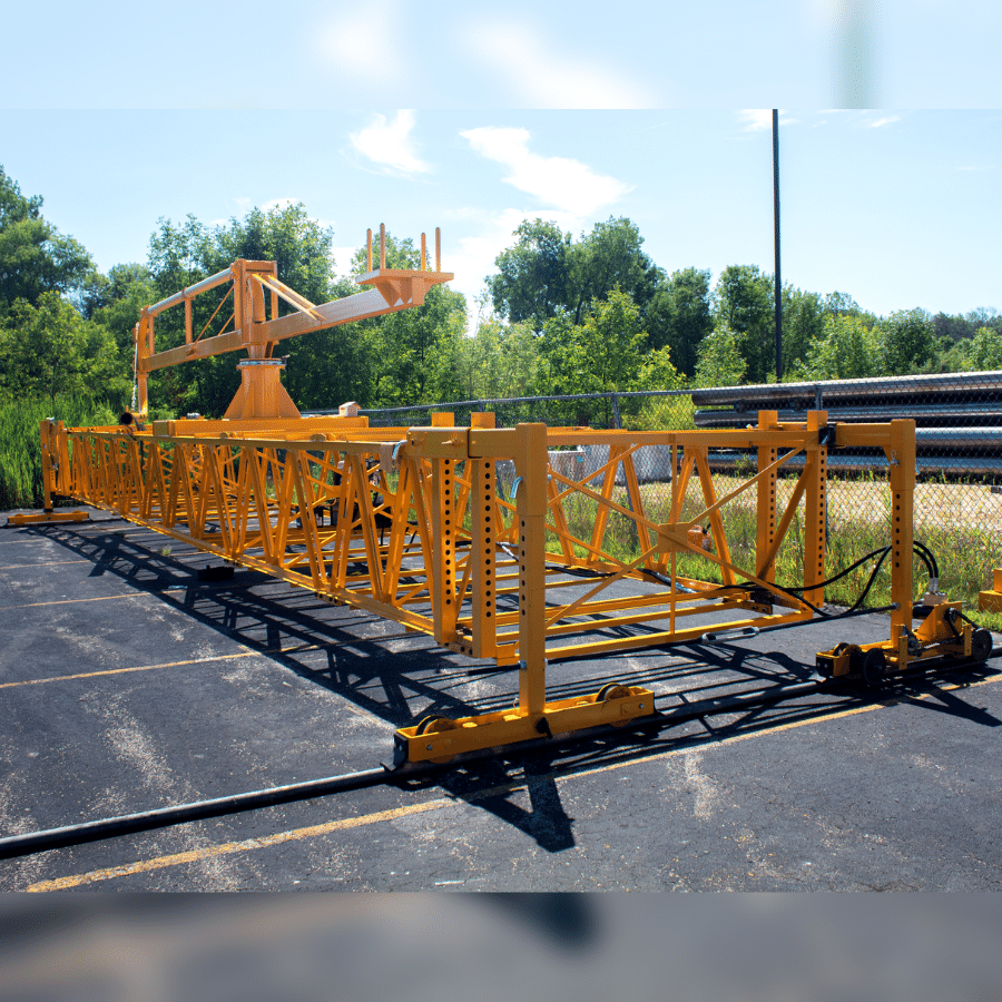 a concrete pumping bridge deck spreader designed specifically to travel along a bridge under construction and allow placement of concrete