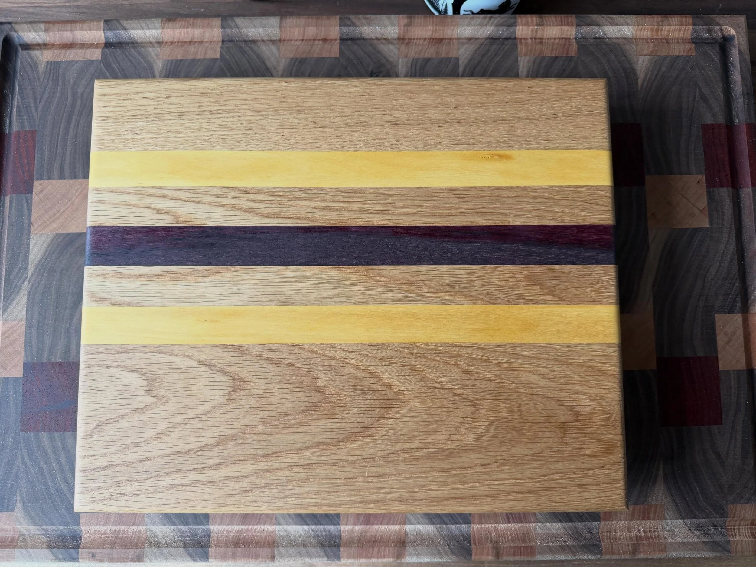 During my last market, I was talking with a customer about different wood species. She liked one of the cutting boards I had built, but wanted a different wood as the accent. We talked it over and went with purpleheart and yellowheart to complement t
