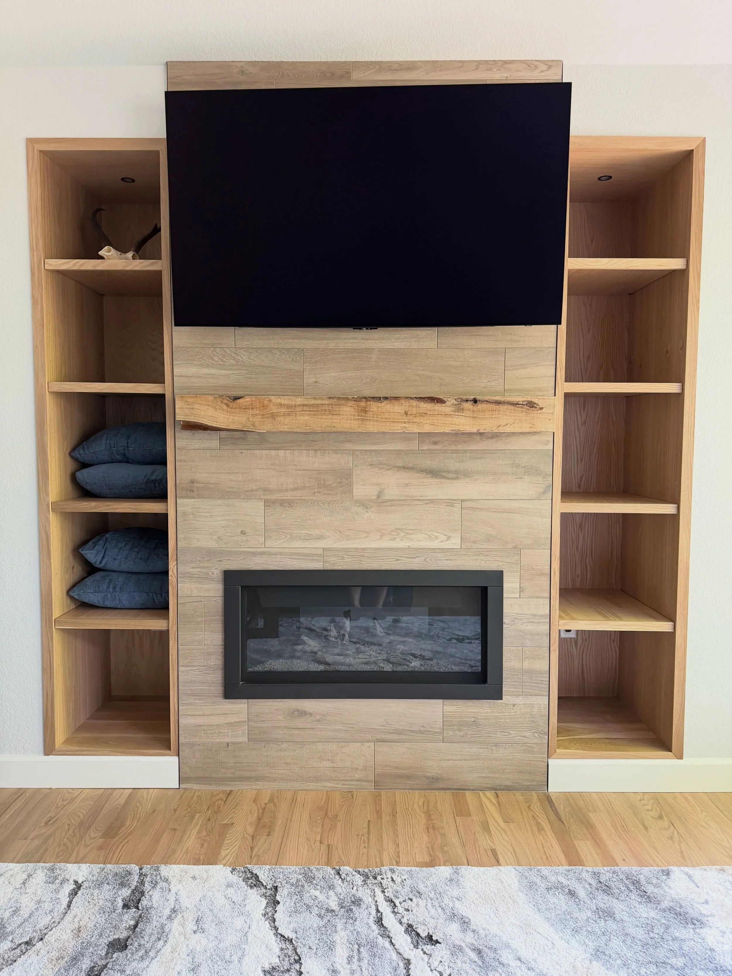 Finally got these bad boys installed! White oak built-in shelving around the fireplace to match the custom beam mantel. Some jobs take a while to get the detail done right, some take a while because the city is holding up your fireplace inspection. W