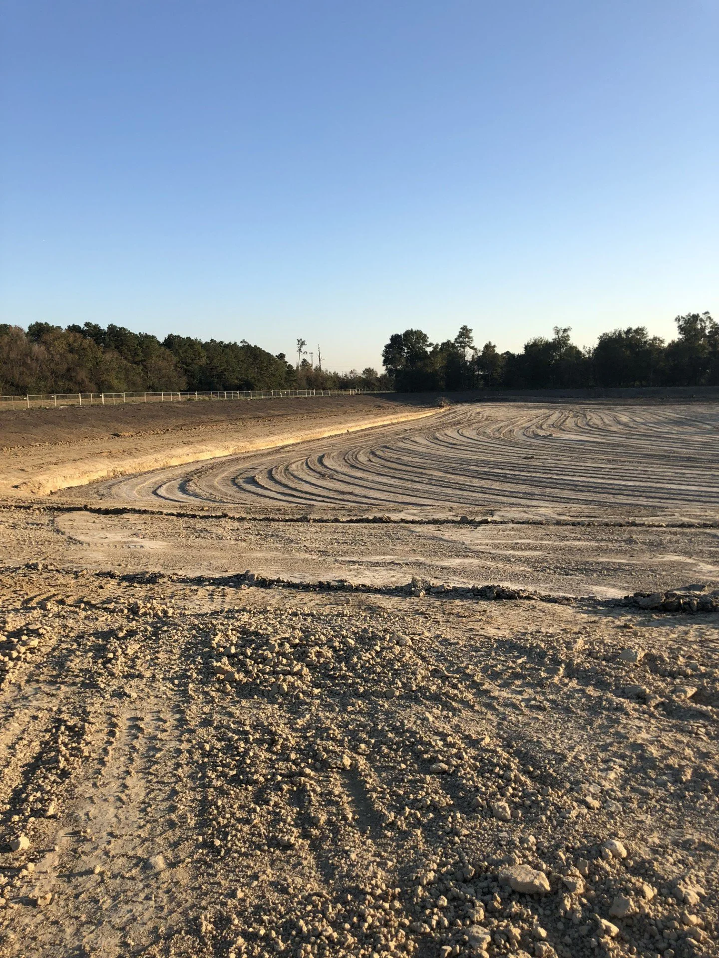 Land grading and site preparation for pond or development project in Hempstead showing smooth dirt work and contour shaping