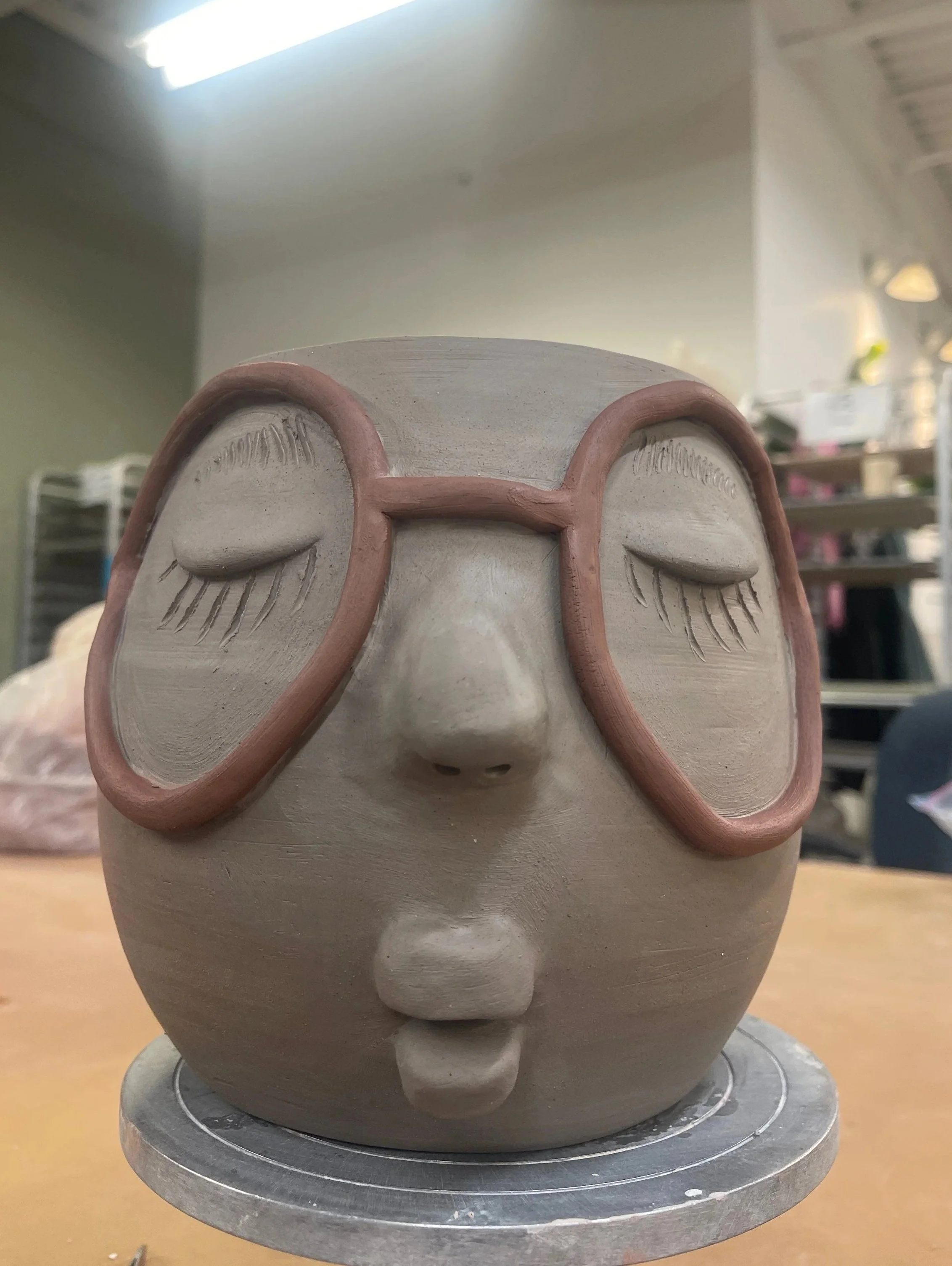 sculpture of a plant pot while being made. 