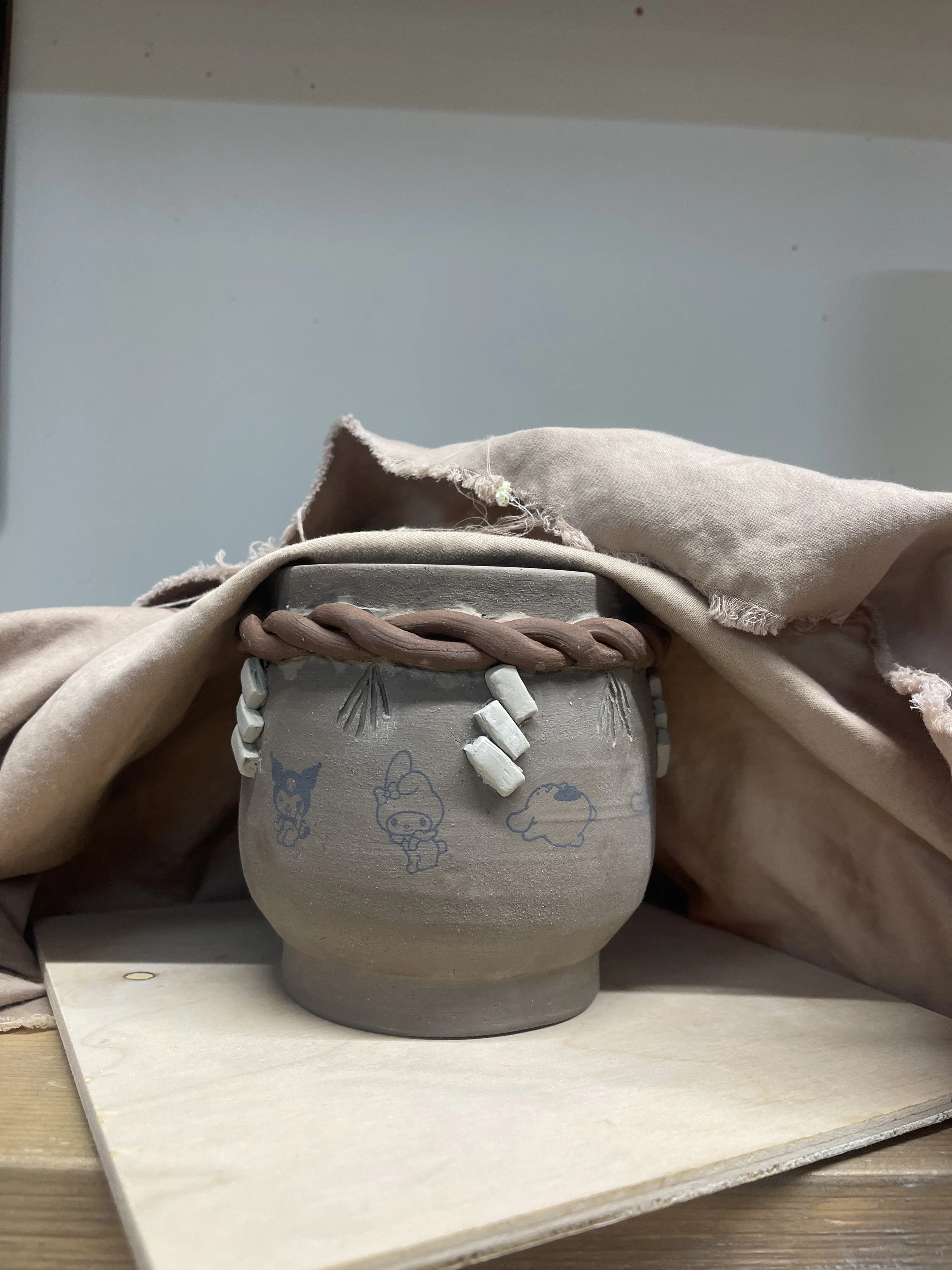Pottery while being dried under cloth before bisque firing