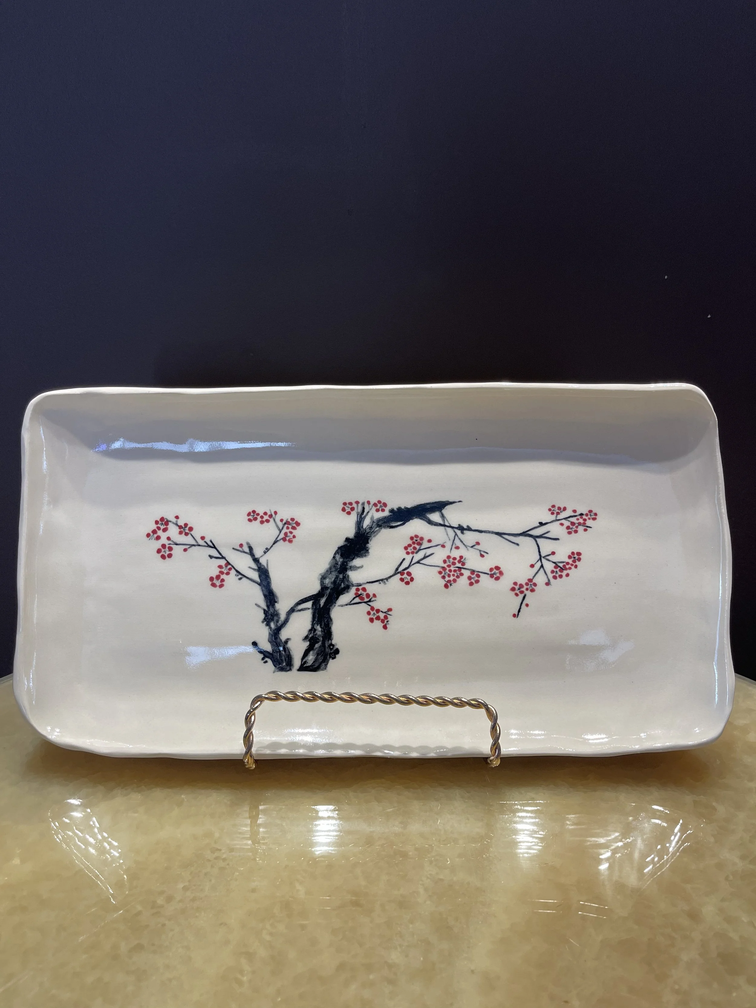 This is in memory of my grandmother, who created beautiful ink wash painting. I traced them with underglaze to produce this plate. 