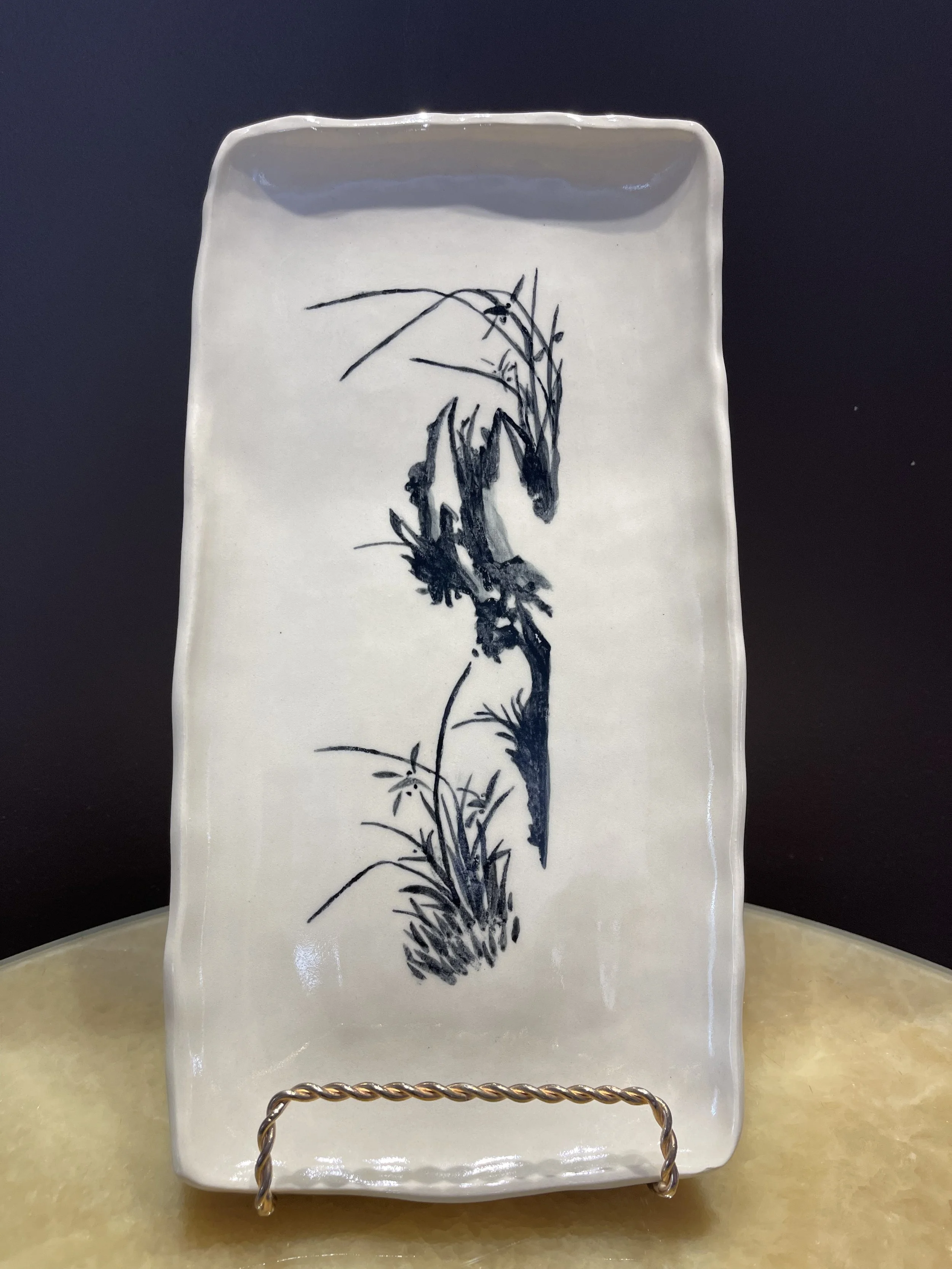 This is in memory of my grandmother, who created beautiful ink wash painting. I traced them with underglaze to produce this plate. 