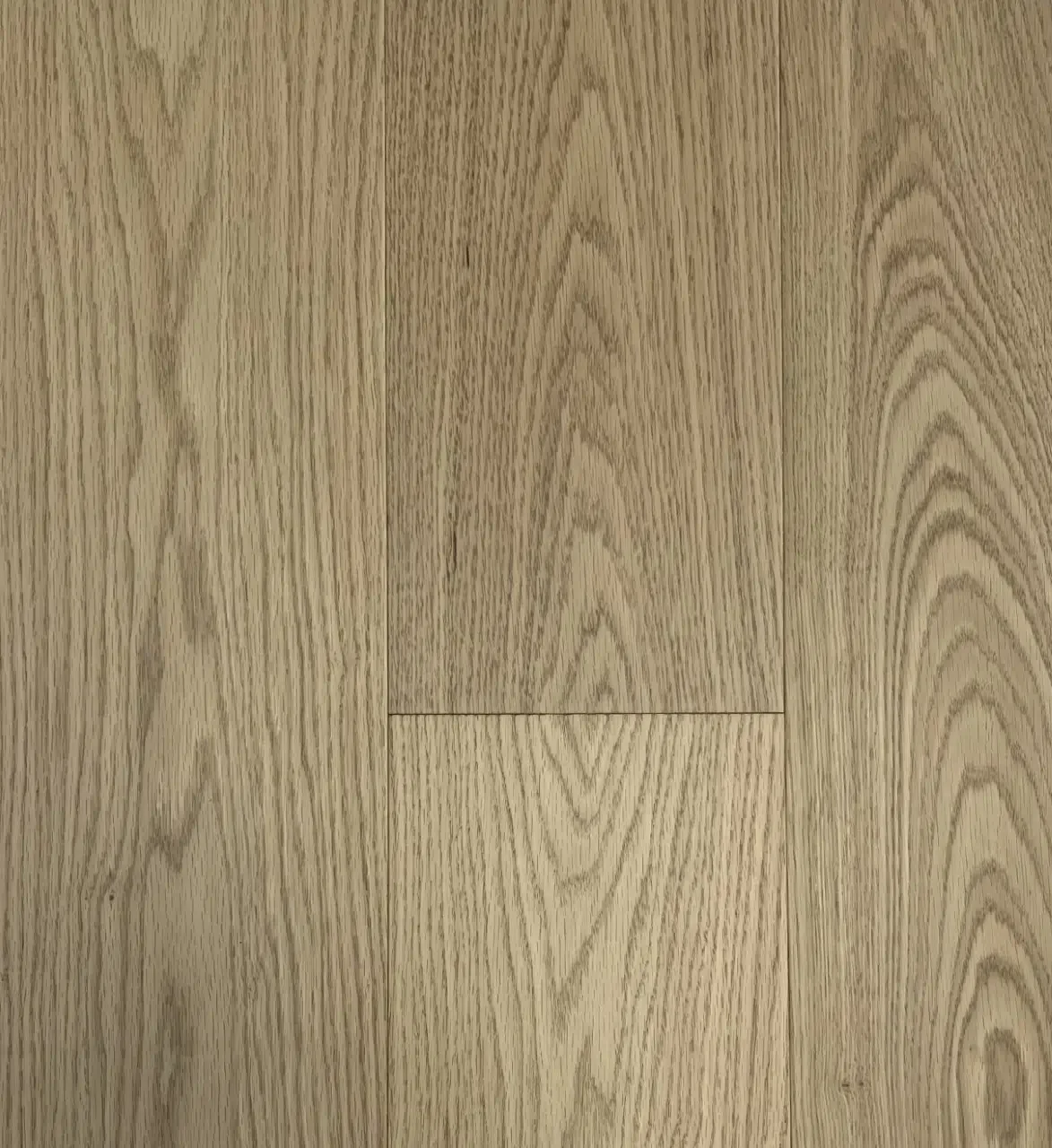 Close-up view of light wood flooring with visible grain patterns.