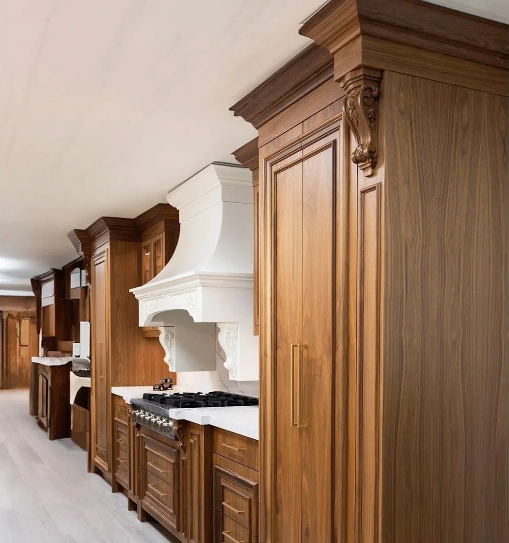 Kitchen with wooden cabinets, a white range hood, and a stove.