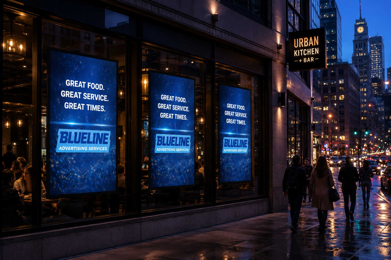 Night scene of a city street with people walking in front of a restaurant called Urban Kitchen + Bar. The restaurant has large digital screens in the window displaying an advertisement with the text 'Great food. Great service. Great times.' and a logo for Blueline Advertising Services. The street is wet from rain, with reflections of lights and cars, and tall buildings with illuminated windows can be seen in the background.