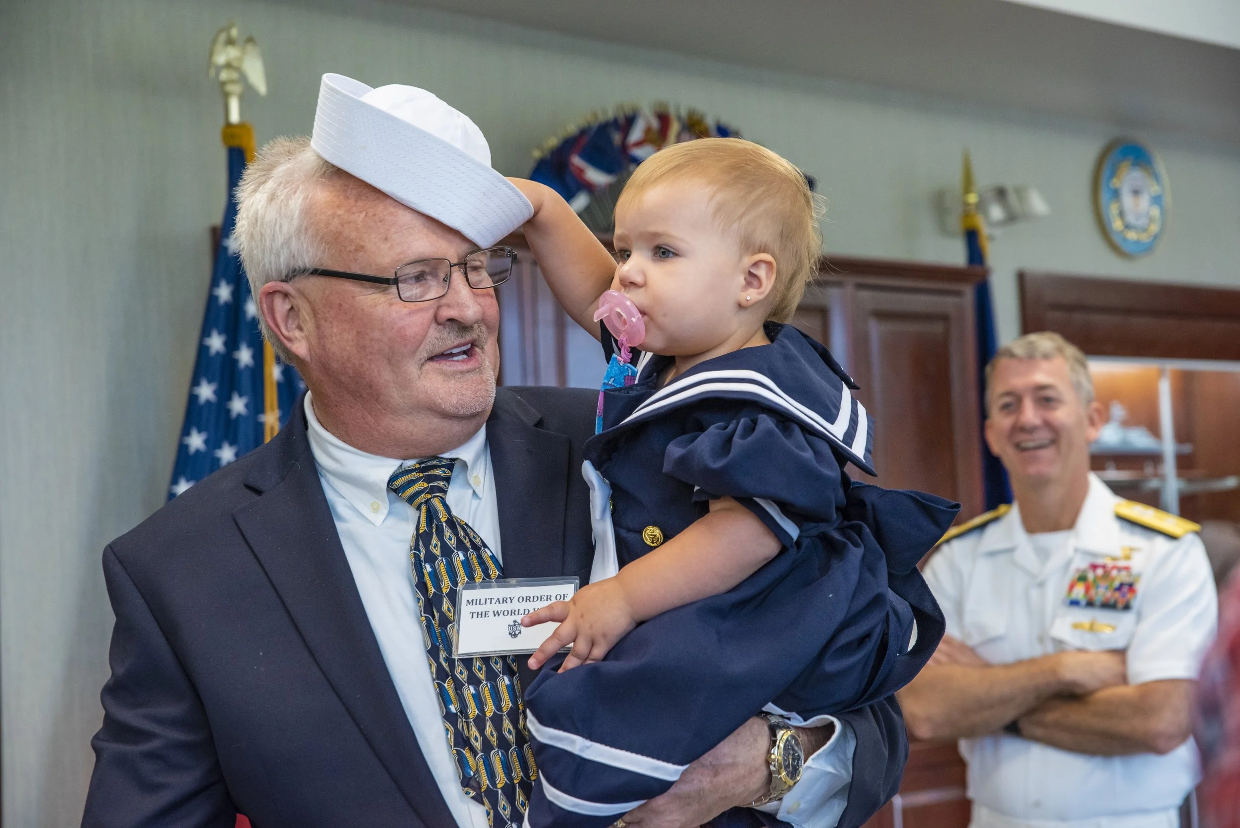 Relatives of a recruit award winner attend a post-graduation reception, at Midway Ceremonial Drill Hall at Recruit Training Command.