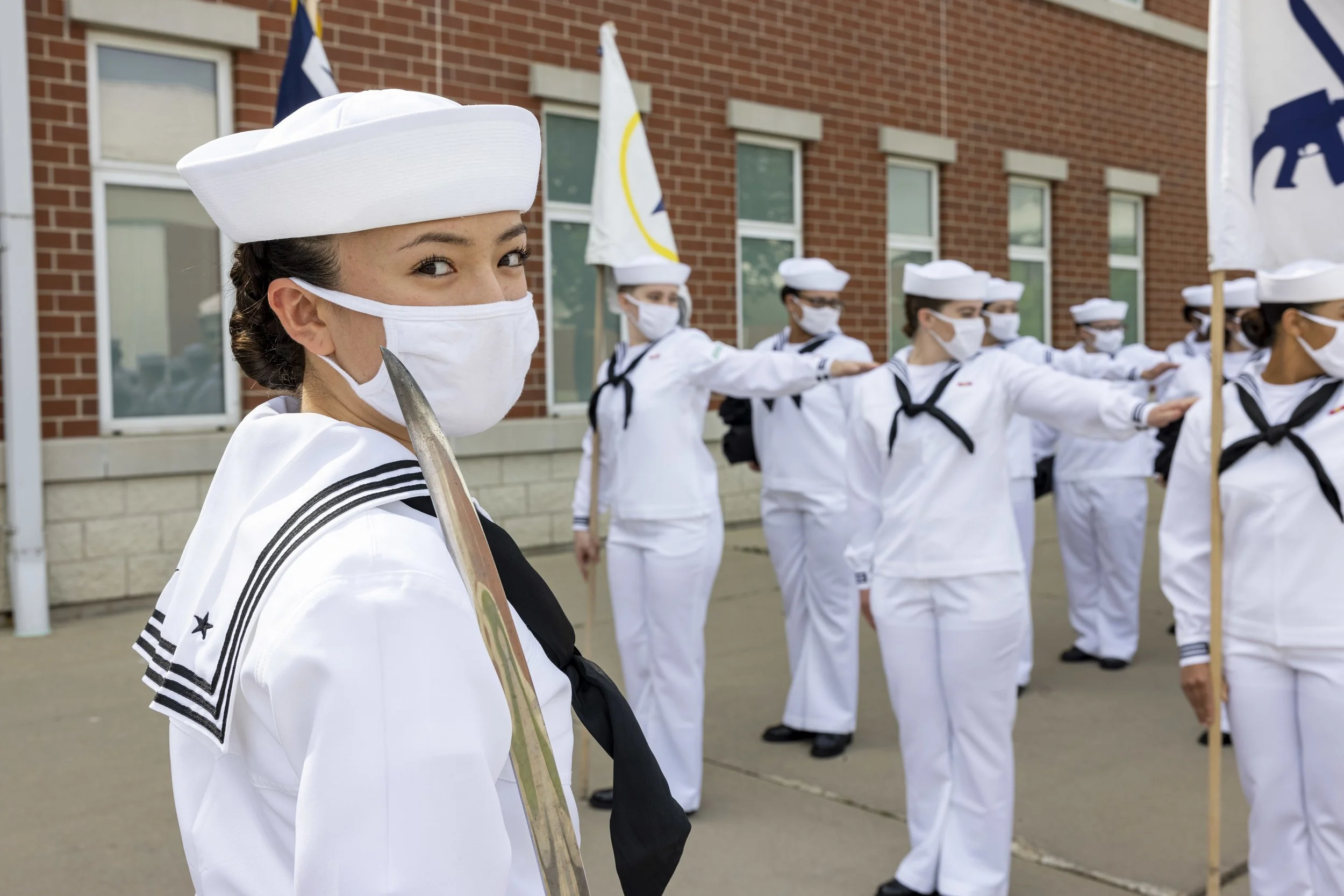 Seaman Recruit Anisia Yang, a graduating recruit chief petty officer, stands before her assembled division at Recruit Training Command. More than 40,000 recruits train annually at the Navy's only boot camp.