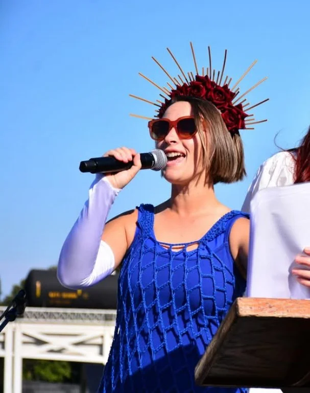 Mandy speaking on stage at a Nashville No Kings rally