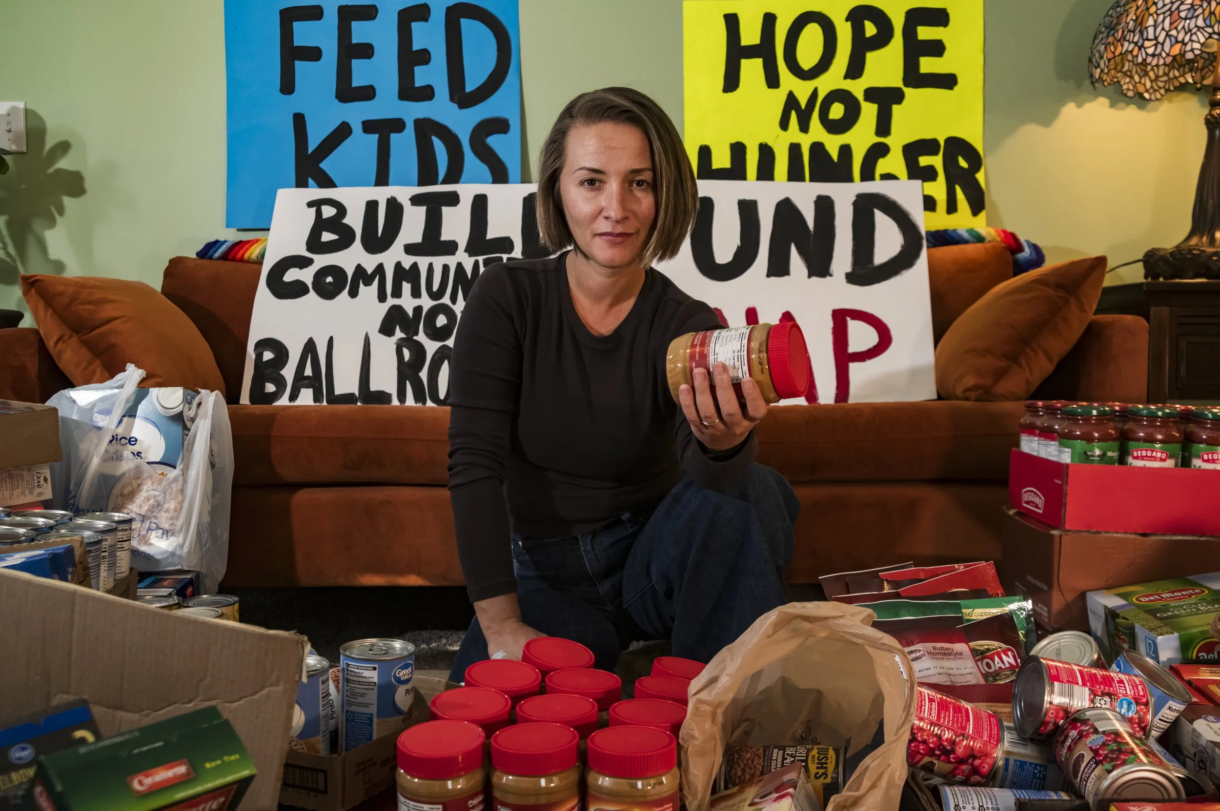 Mandy holding items from a food drive she helped organize