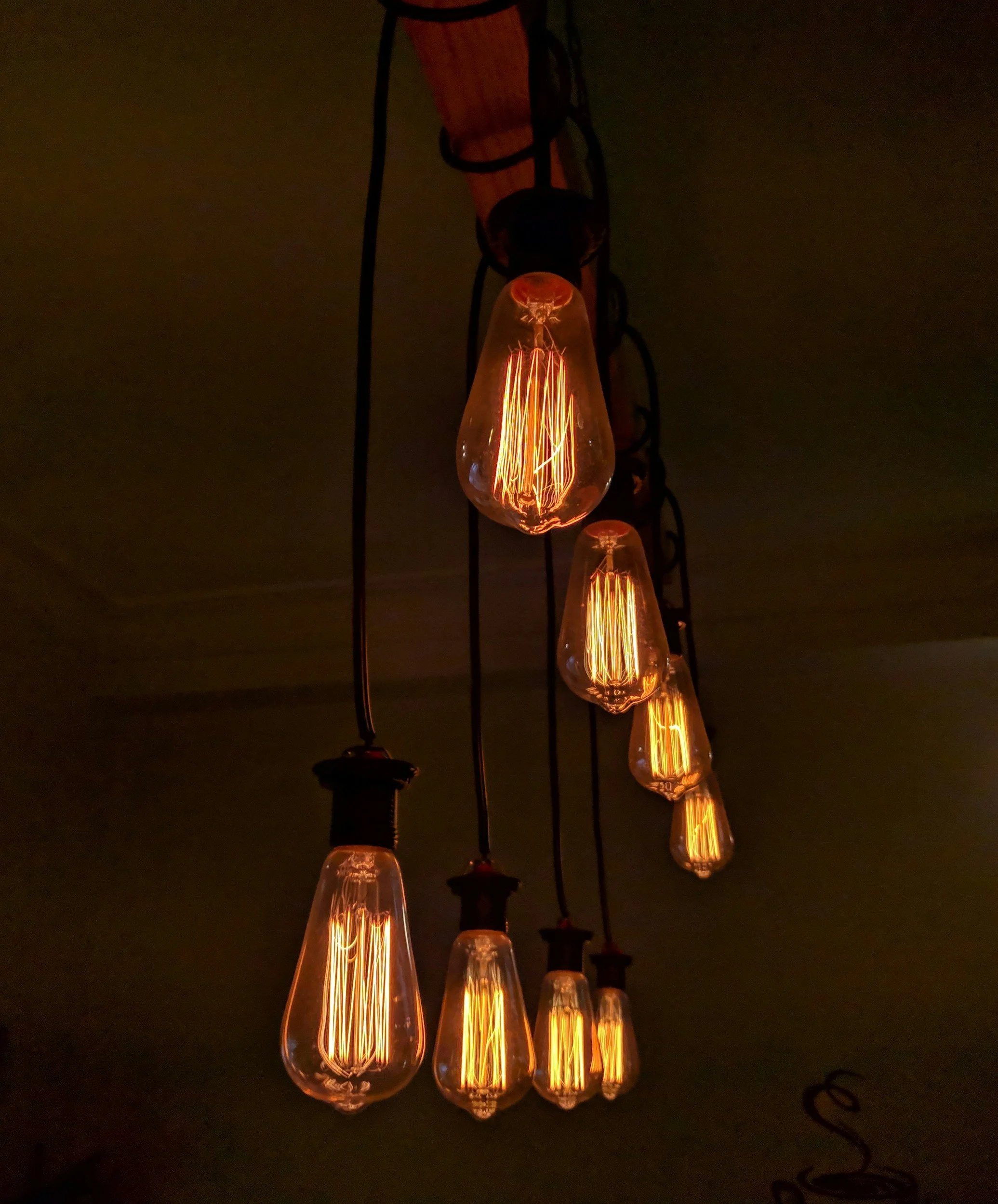 photo of old fashioned lit light bulbs