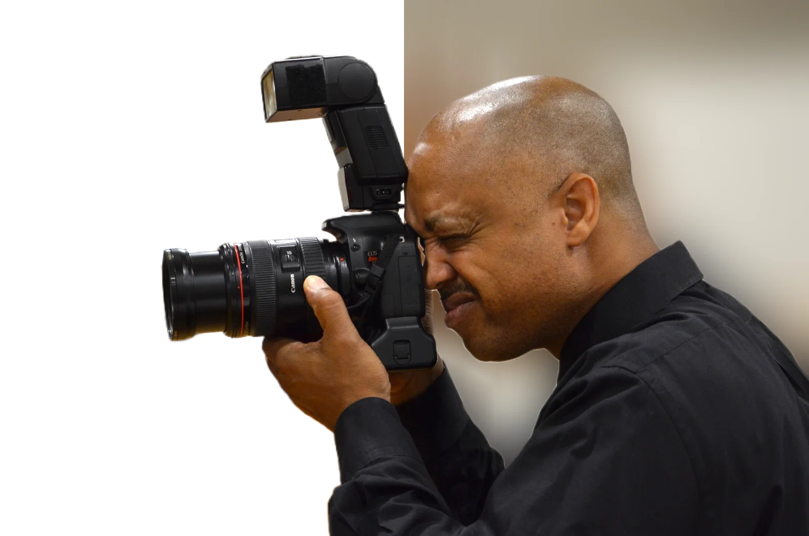 image of a photographer holding a large camera