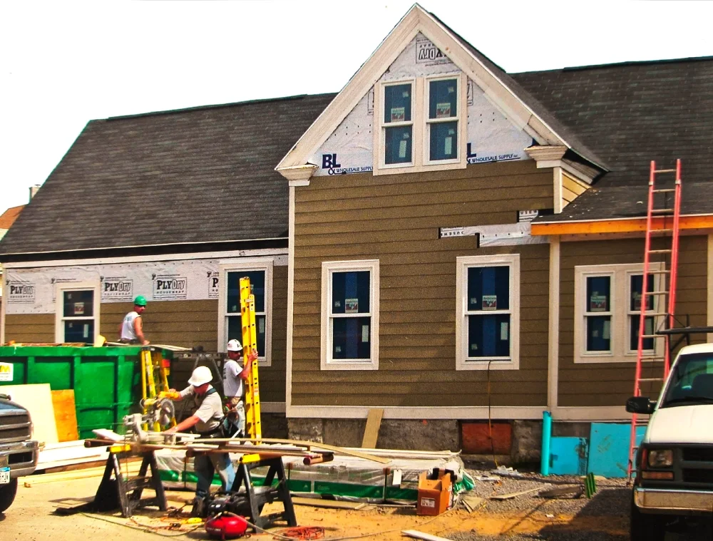Putting on new siding and windows.