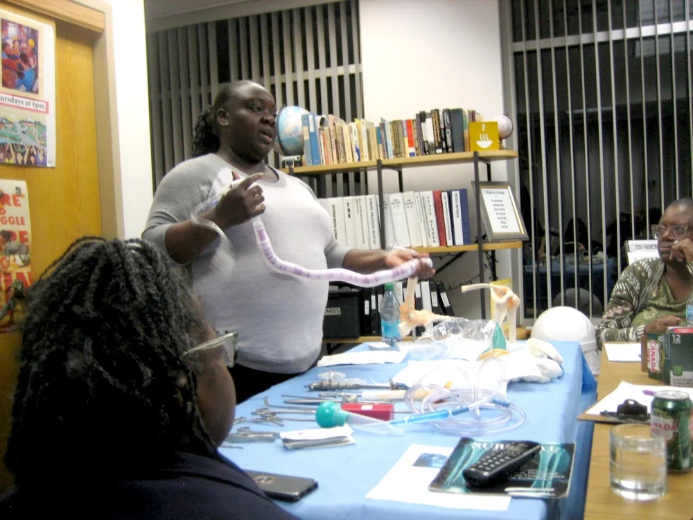 Volunteer displaying surgical equipment