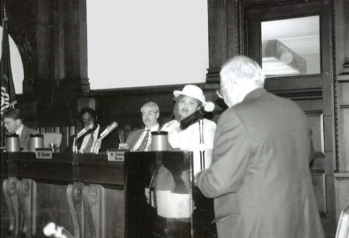 Man testifying in front of officals.