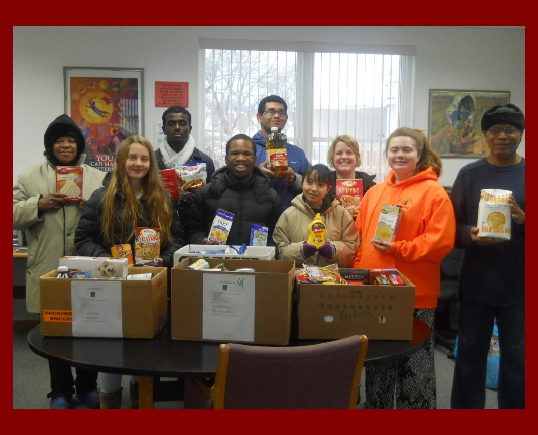 A group of students showing a table of collected food