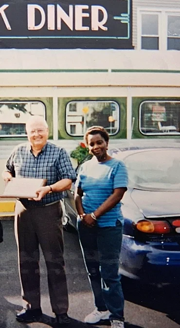 Business owner in front of his diner.