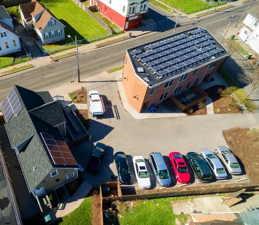 Aerial photo of solar panels on top of two buildings