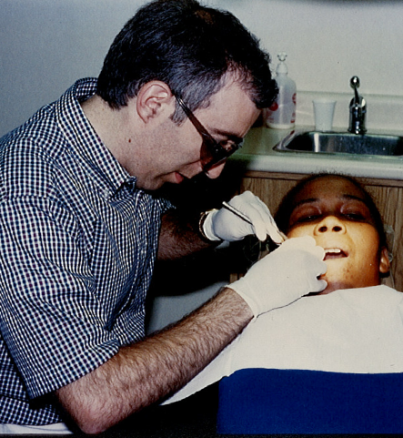 dentist treating a patient in a dental chair