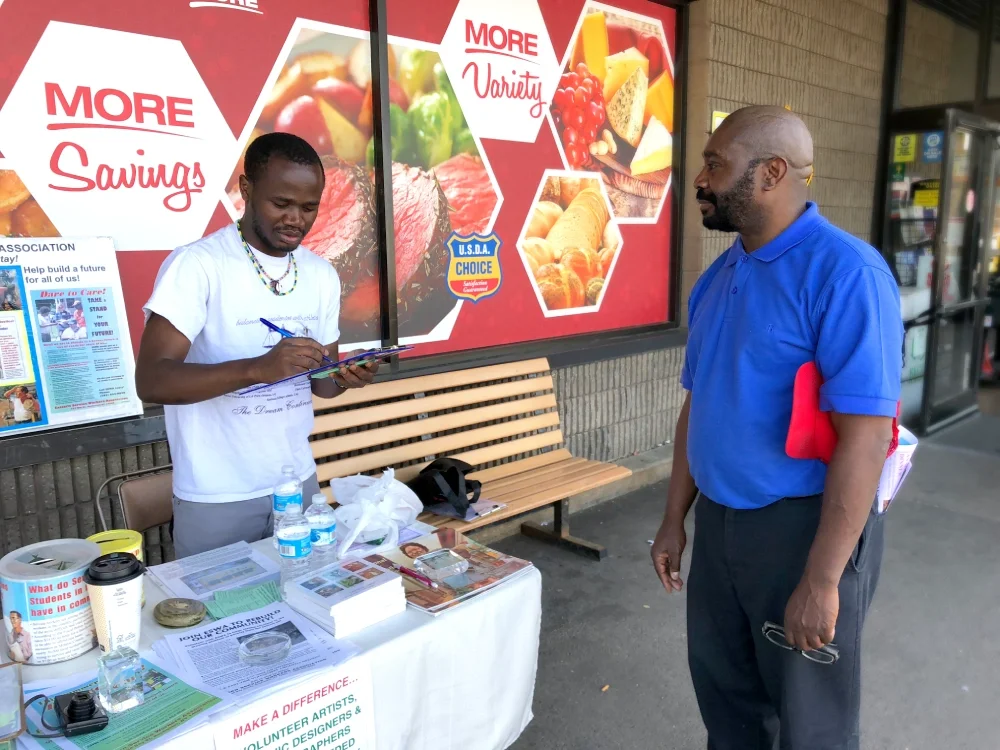 Volunteer conducting  a literature table