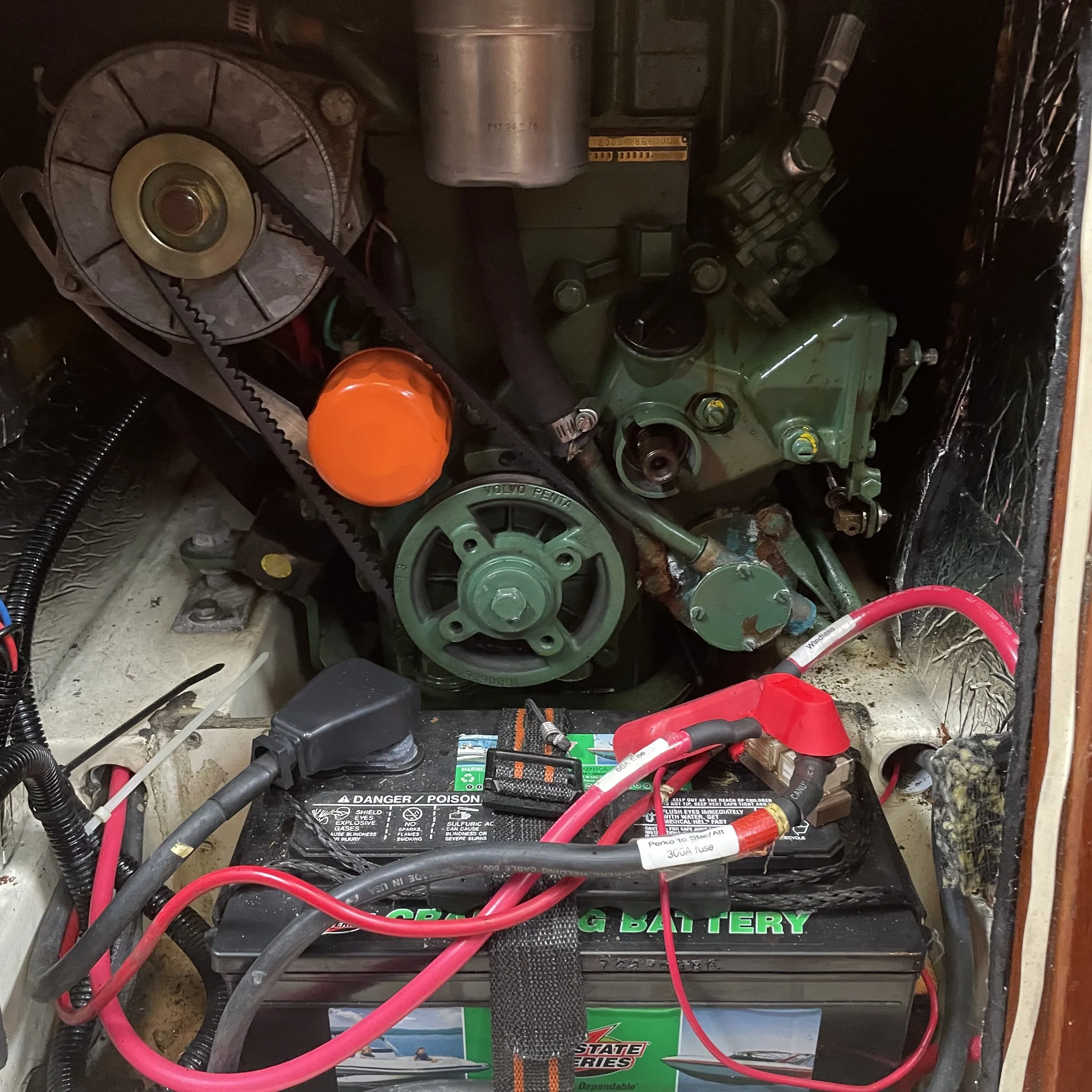 Front access to Volvo Penta 2003 raw water cooled engine. Cranking battery is lead-acid and is on a separate circuit from the lithium house bank.