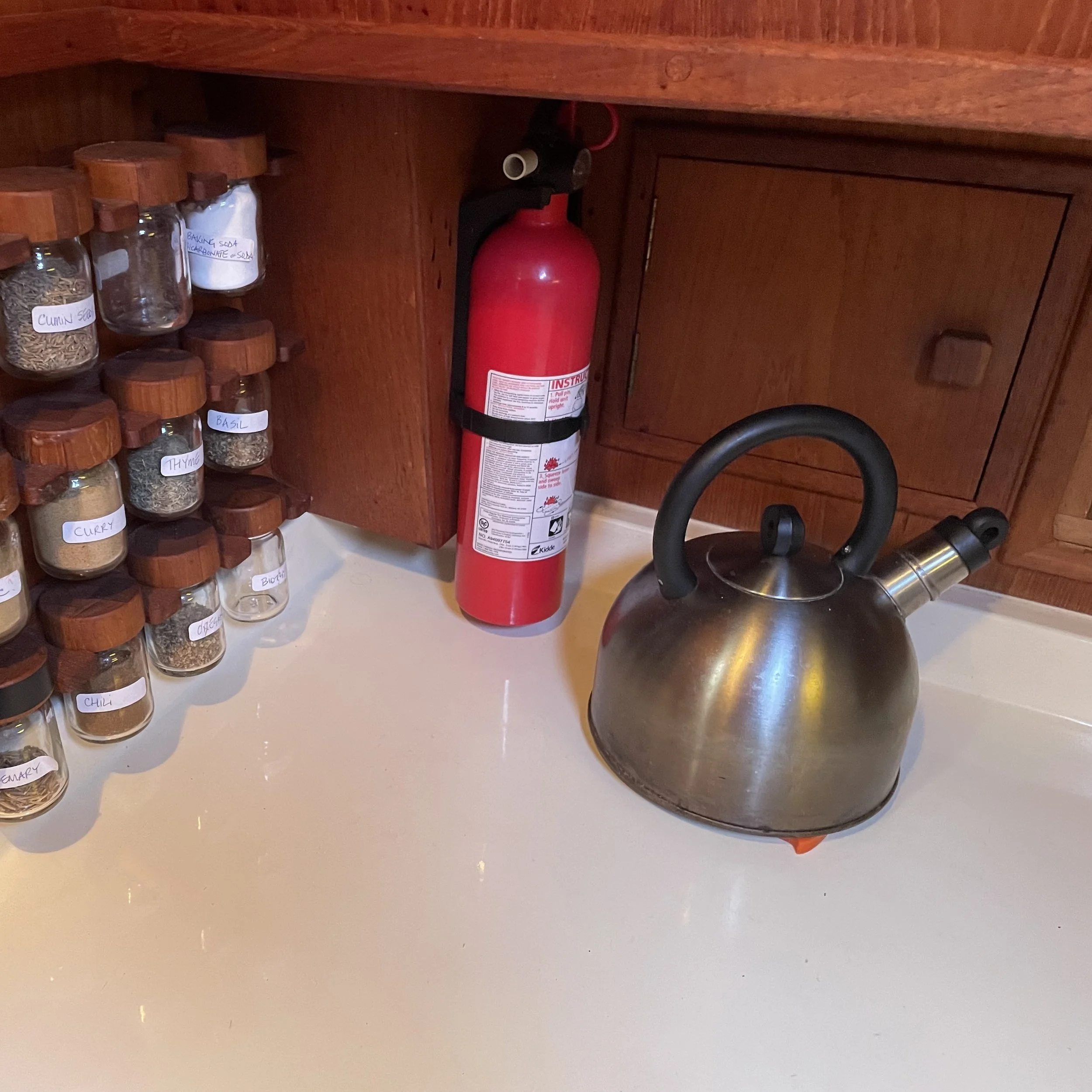 Spice rack and door to recycling bin in the lazarette.