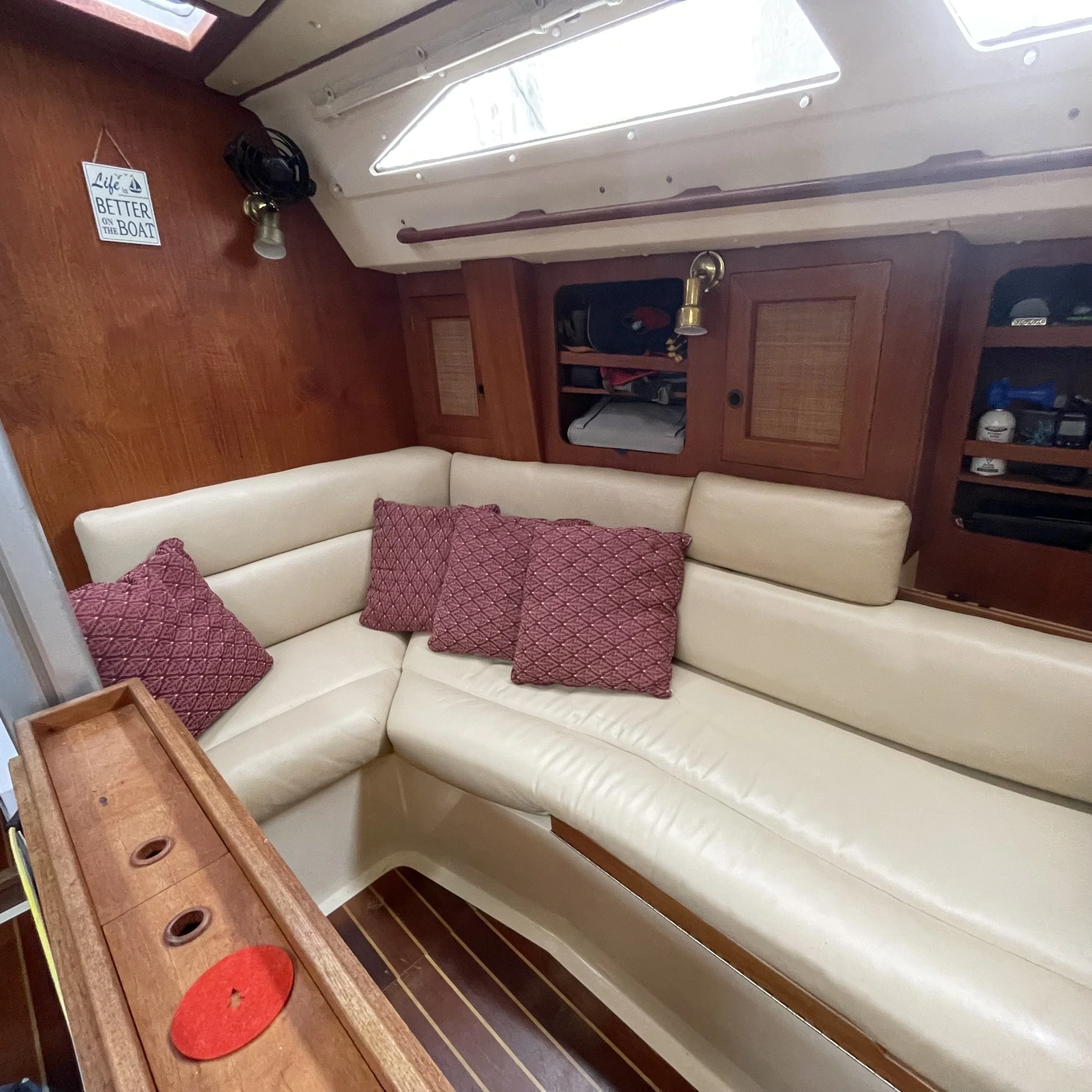 Starboard settee folds out to form a double berth. 