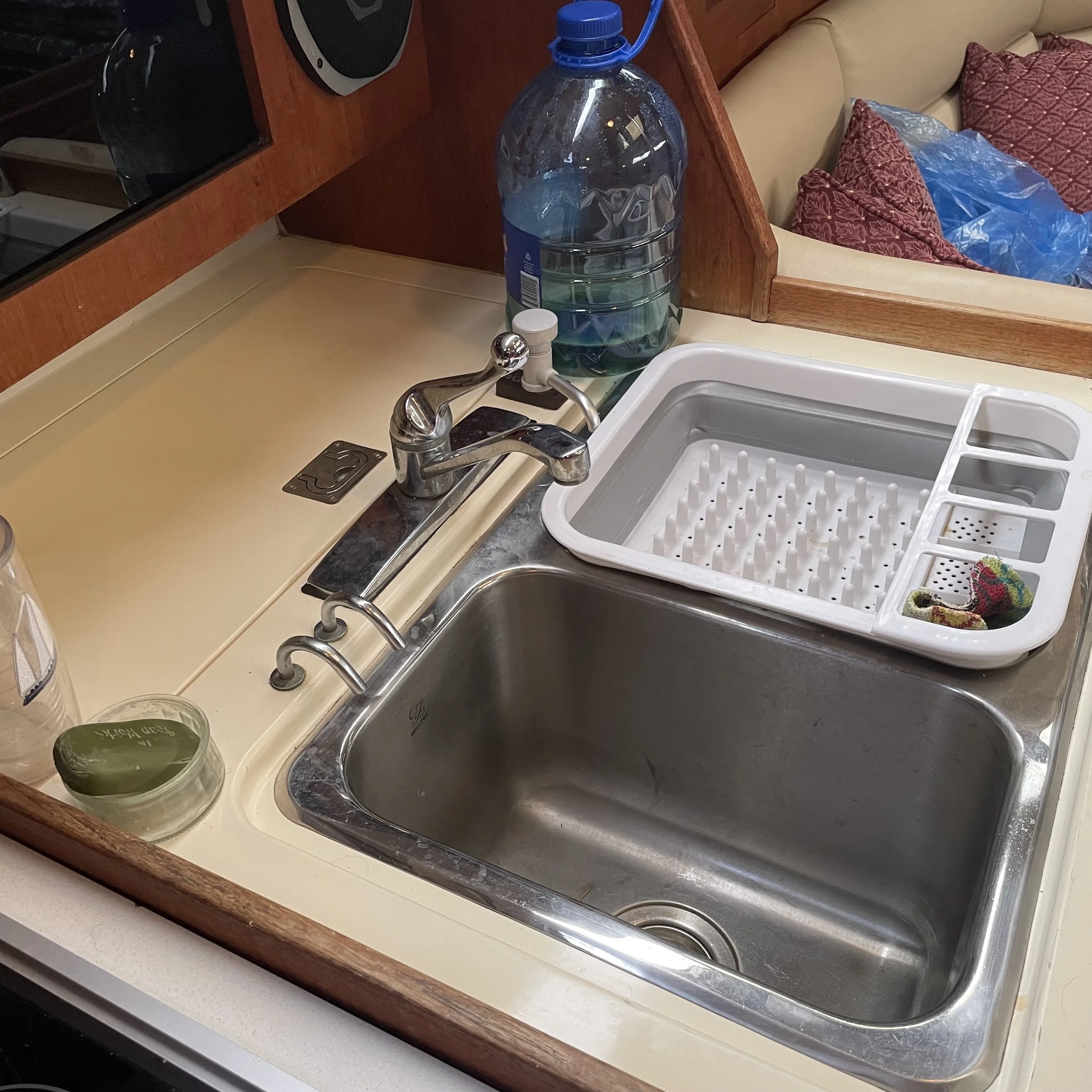 Double sink is brought forward for better drainage under way, with cooler behind.