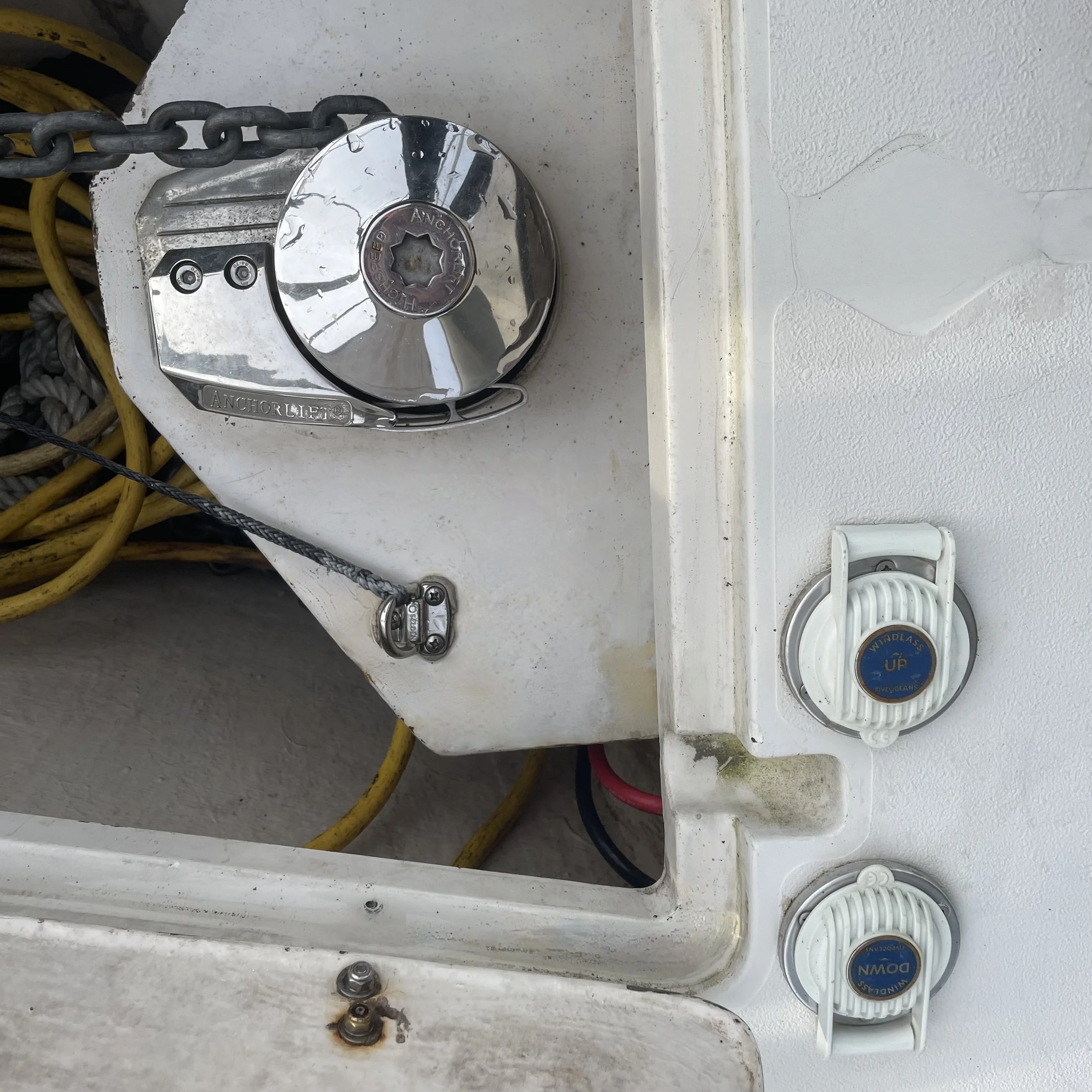Windlass is positioned within the large chain locker featuring both foot controls as well as a control from the helm.