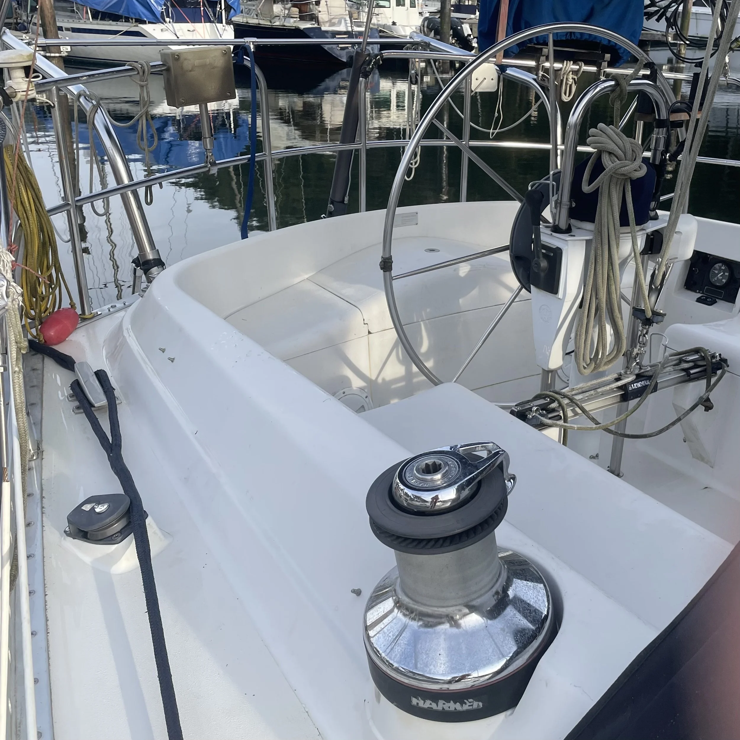 The side winches are oversized Harken winches. The steering is Whitlock rack and pinion. The traveler is just forward of the helm allowing mainsheet adjustment by the helmsman or from a cabin-top winch under the dodger.