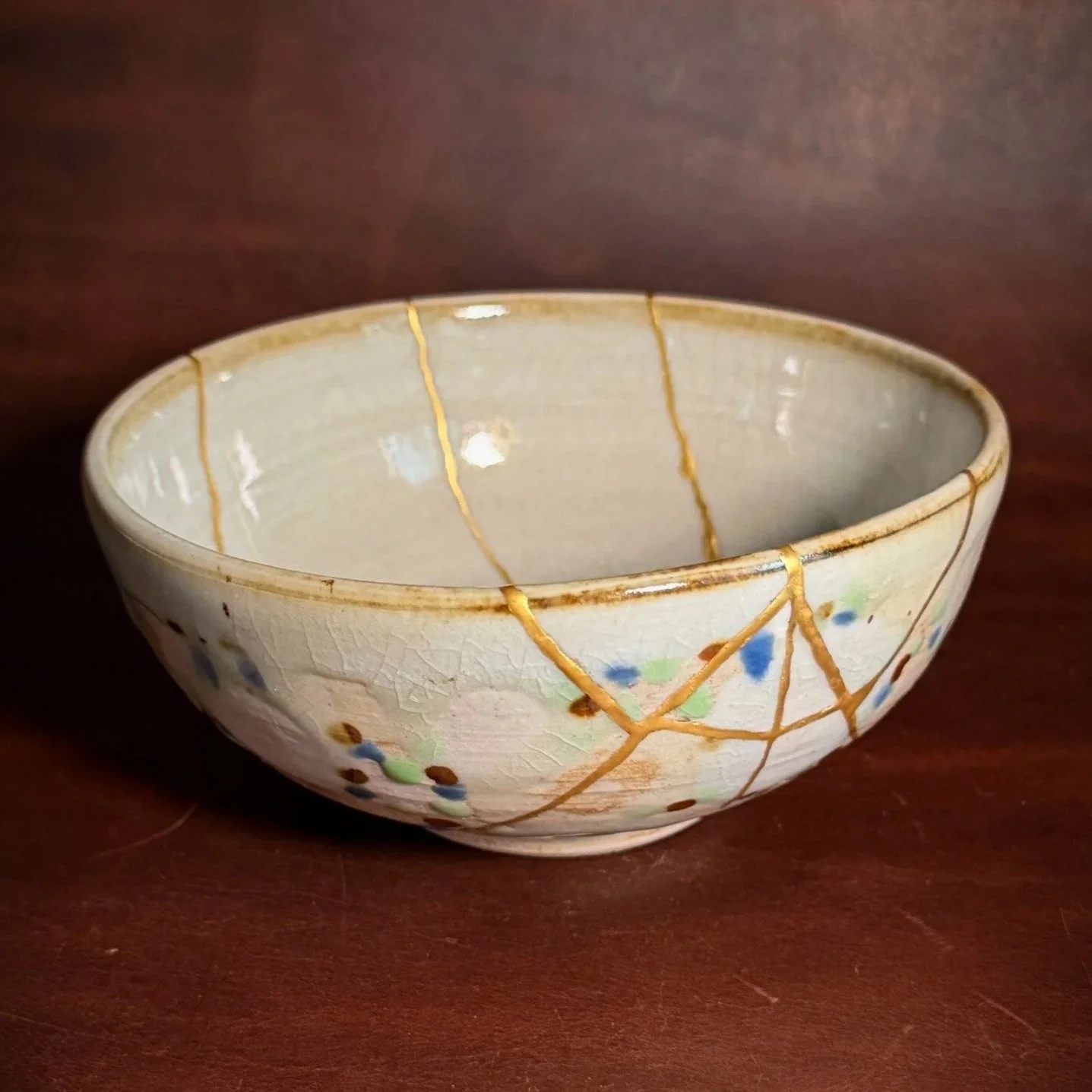 This bowl came to me from a repeat customer, and I was so happy to add another piece to her growing kintsugi collection. We don’t know the original artist, but I love the soft pink glaze and the little flecks of blue, green, and brown. This is also s