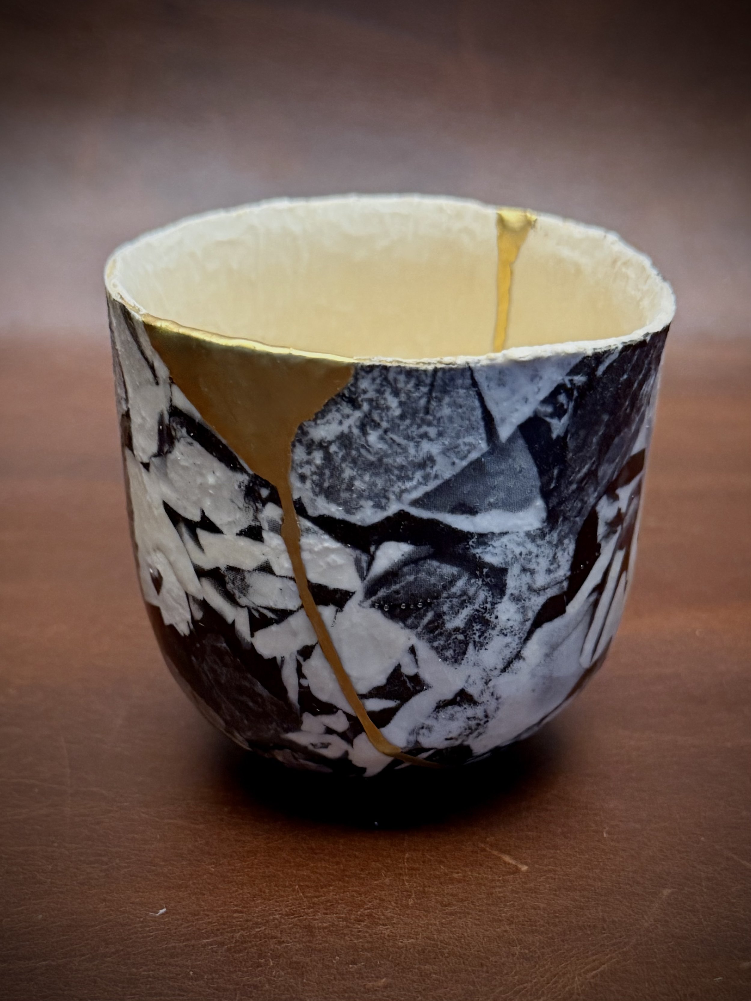 This small sake cup was brought to me by its owner’s wife. It's a very special piece for her husband, who first learned about the artist through a close friend who recently passed away. 

Although I don’t know the name of the original artist, it is a