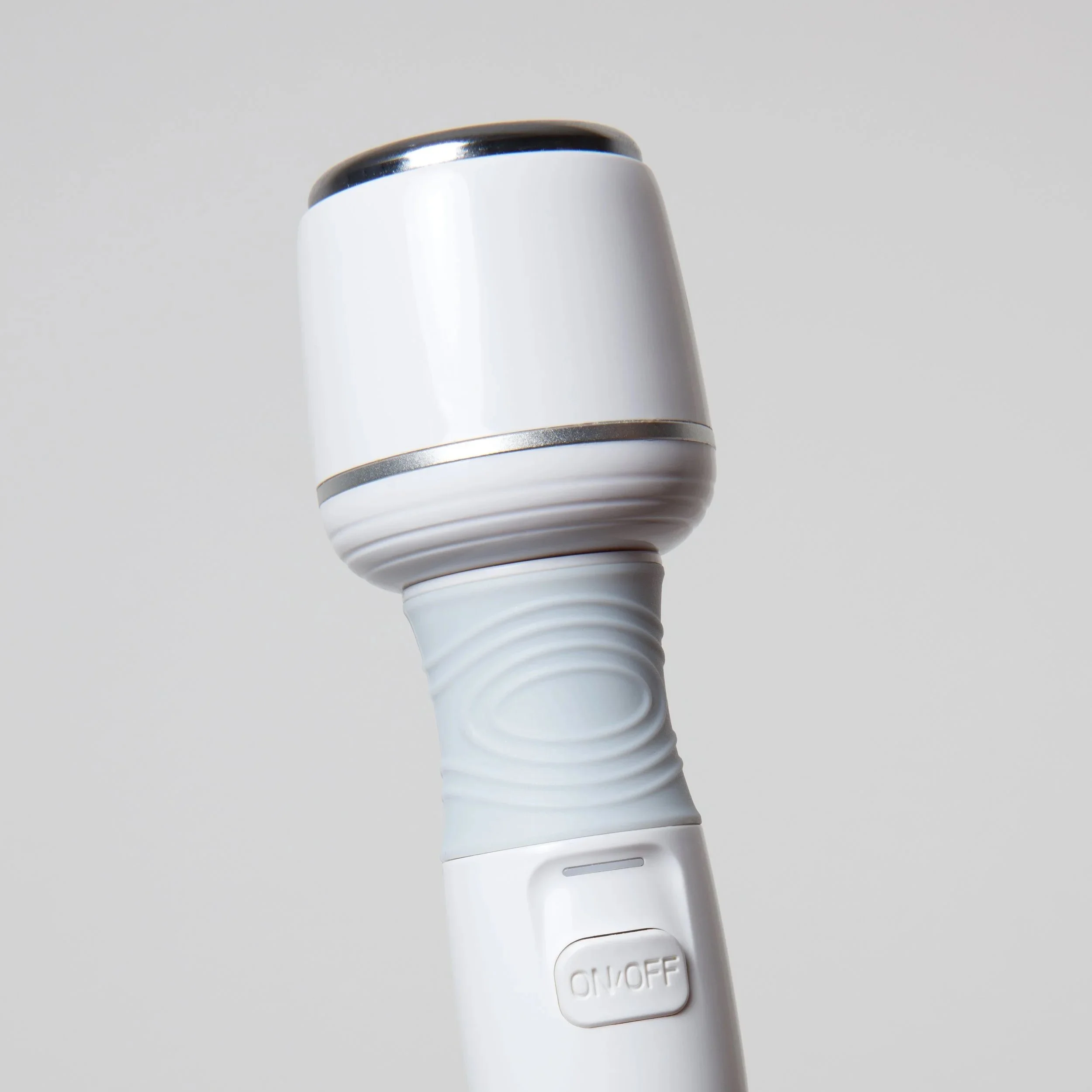 A close-up of a white handheld LED flashlight with a black top and a button that says ON/OFF, positioned against a plain gray background.
