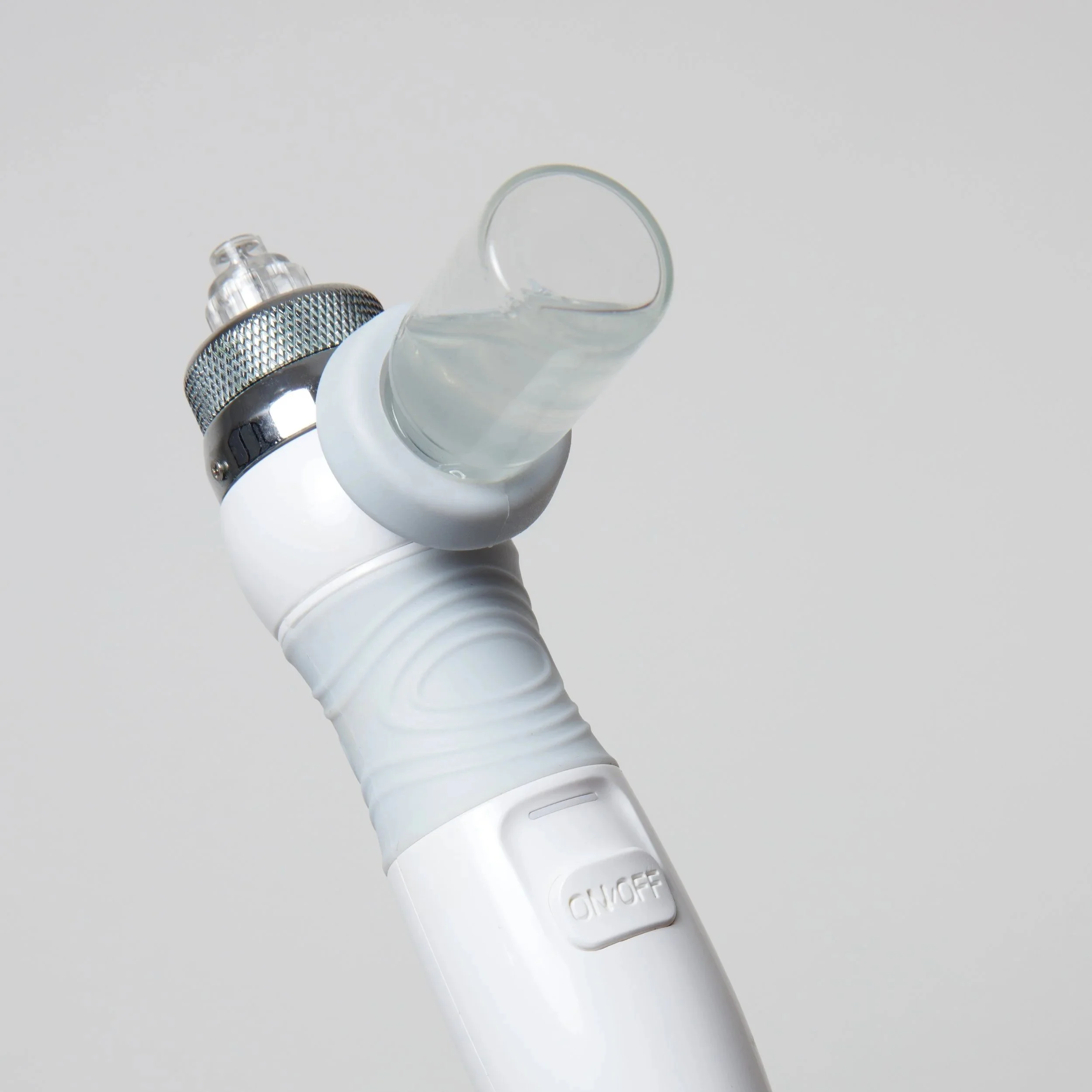 A white electronic vape pen with a transparent mouthpiece and an ON/OFF switch, set against a plain light background.