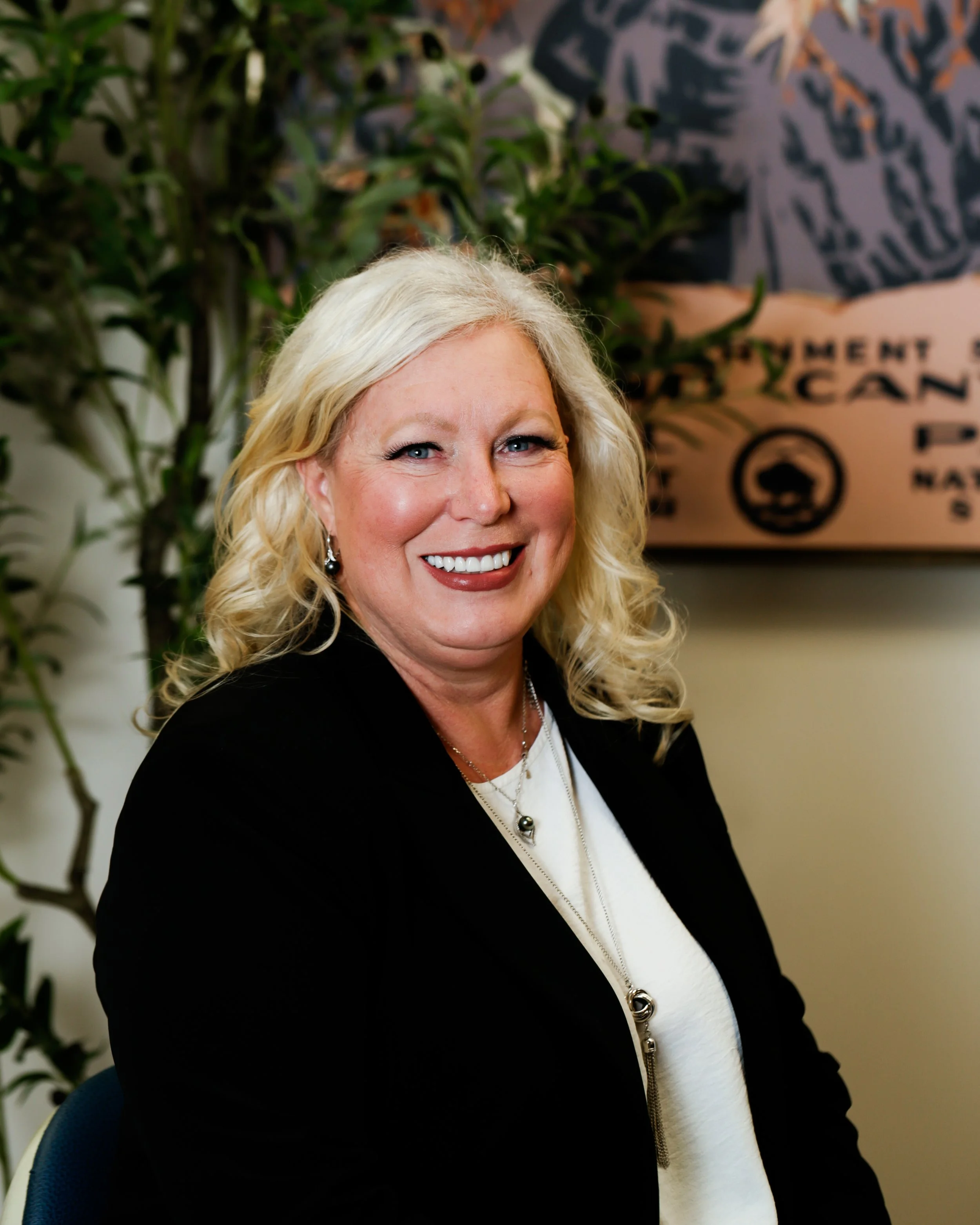 Janeane Bray, experienced dental office manager assisting patients at a Phoenix dental practice.