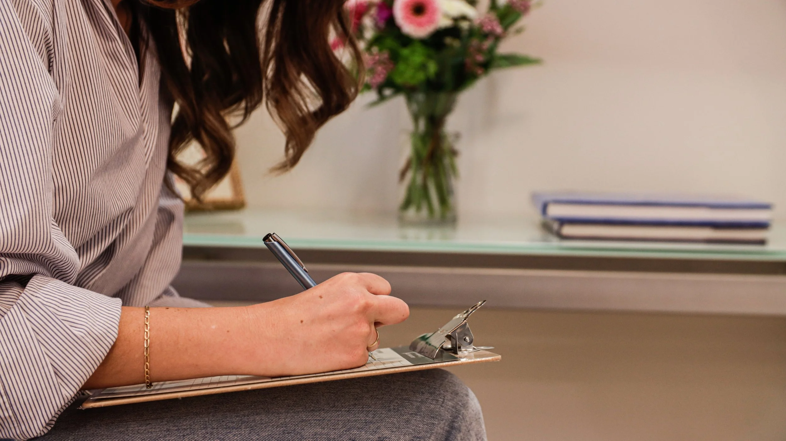 New patient completing intake forms before a dental appointment in Phoenix Arizona