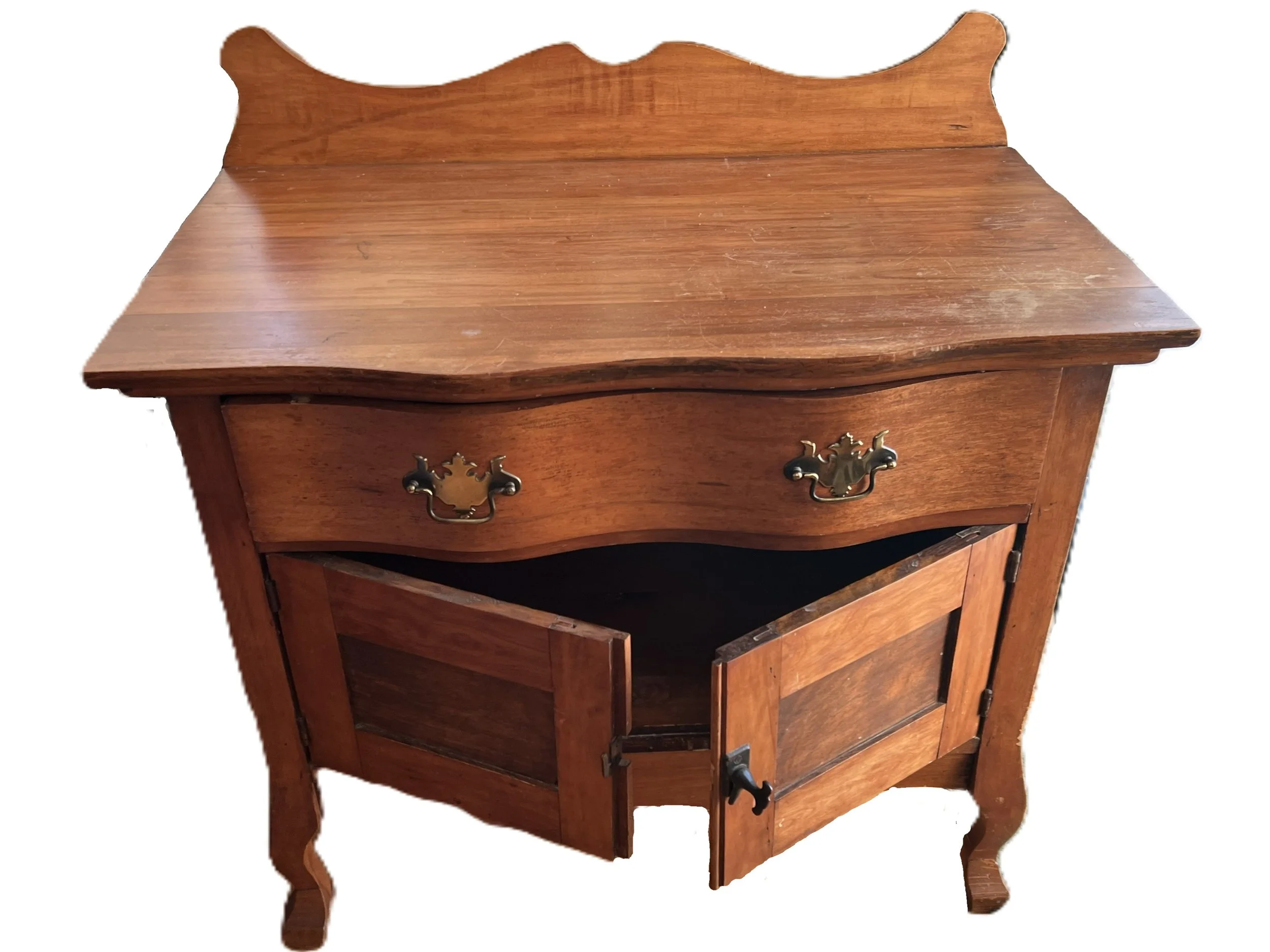An Antique wooden nightstand with two drawers at the top and a cabinet at the bottom with double doors, featuring brass handles and curved legs.