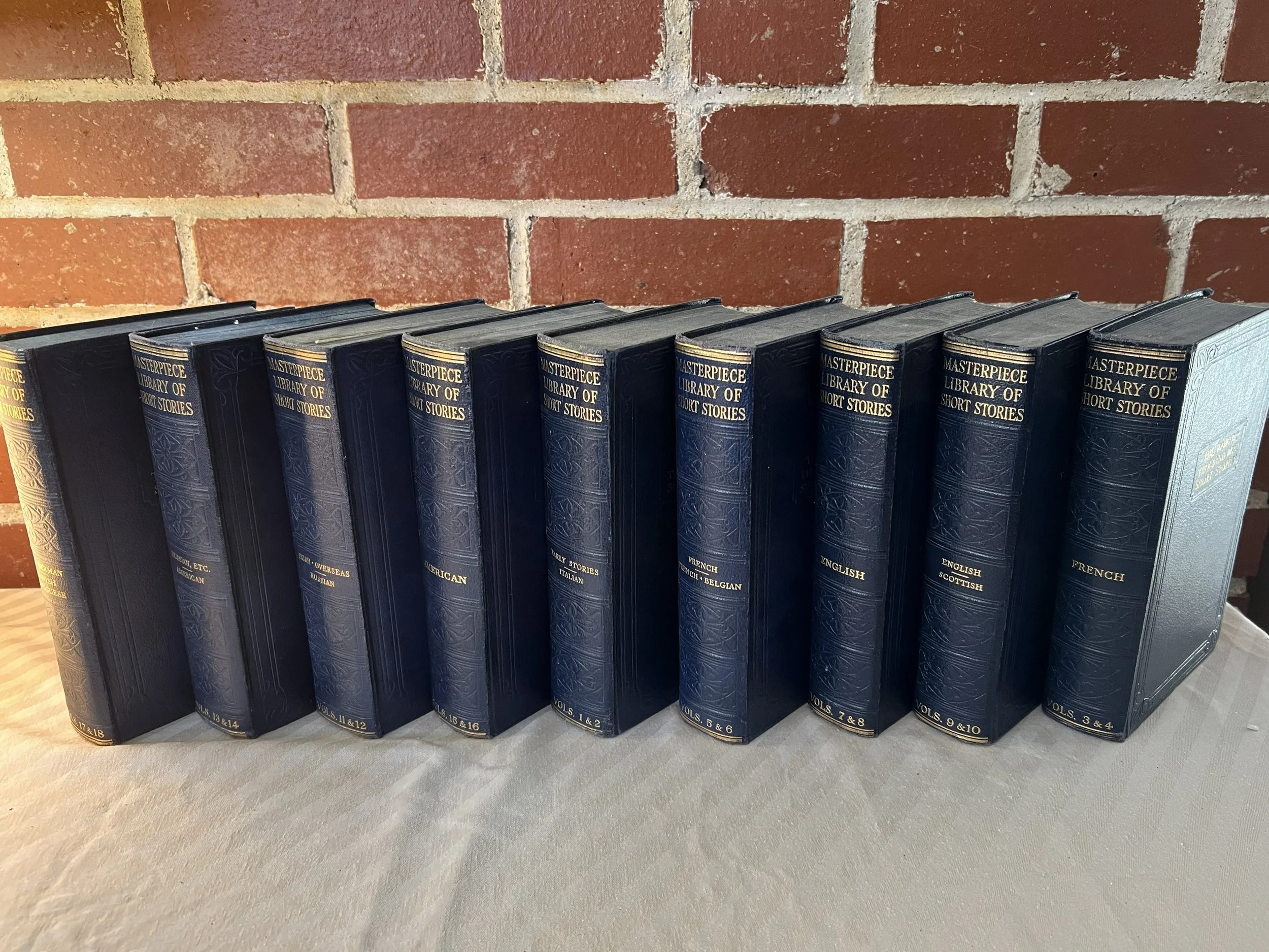 A collection of 10 hardcover books from the Masterpiece Library of Short Stories series