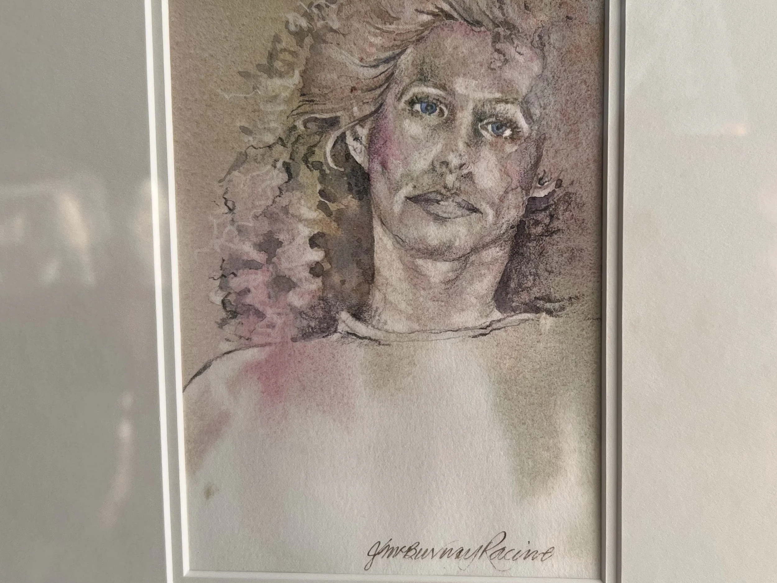 Mixed-media self-portrait by the Canadian artist Jane McBurney Racine. 
Jane McBurney Racine is a visual artist based in Annapolis Royal Nova Scotia, Canada.  She frequently works with a combination of charcoal, conté, and watercolor to create "stron