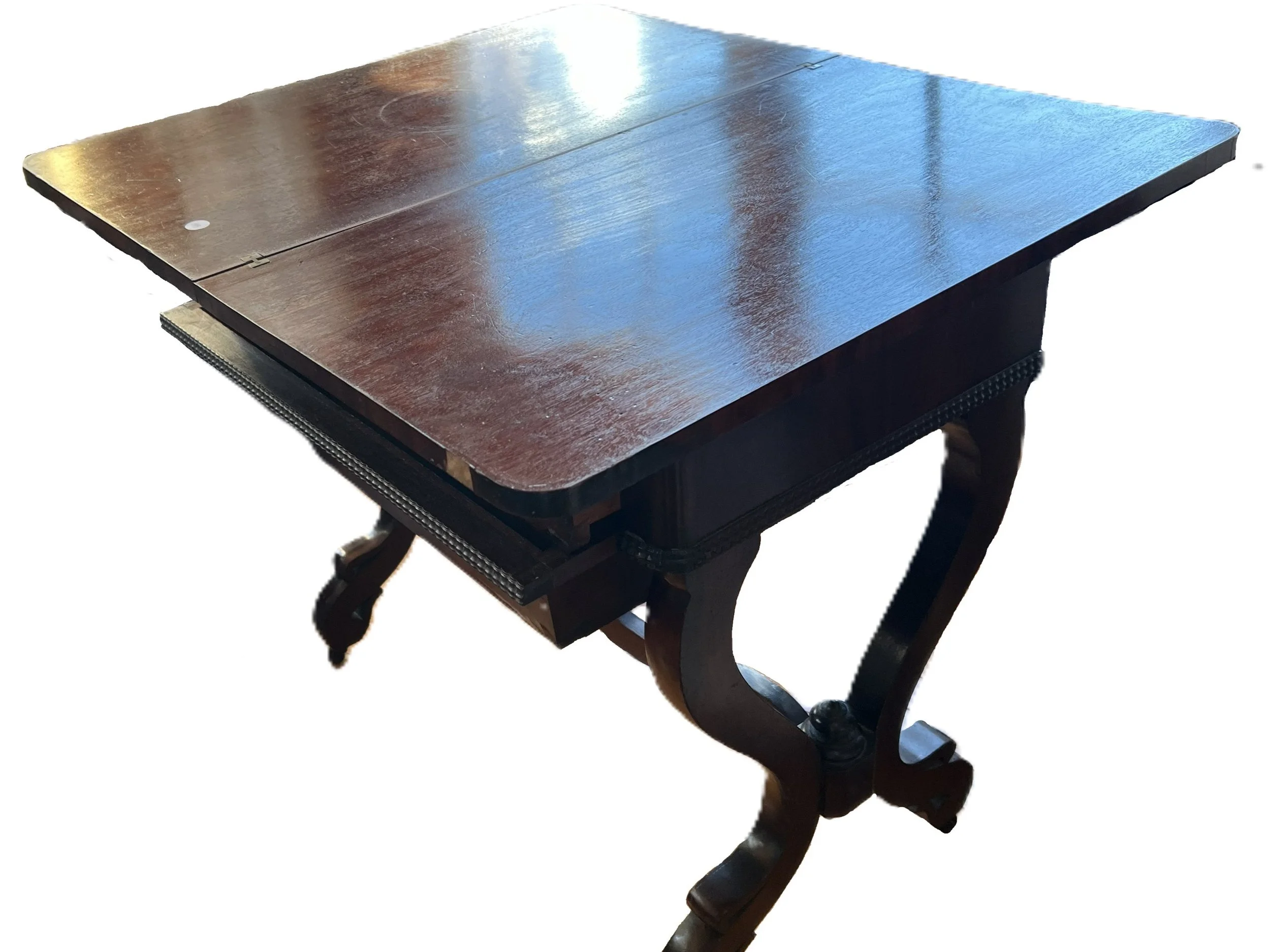 A vintage mahogany drop-leaf table, likely in the style of Duncan Phyfe or a similar Federal-era design. 
Style: Federal style, often featuring curved legs and mahogany wood. 
Function: Features drop-leaf sides that expand the surface area when raise