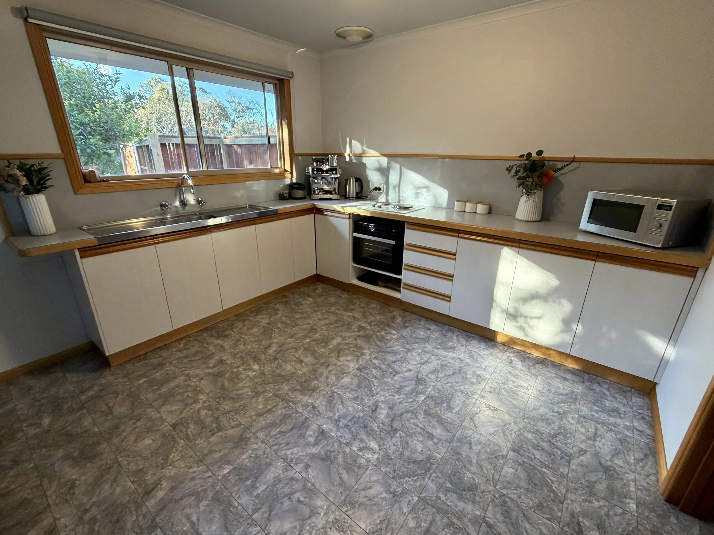 Updated kitchen view including under bench combined air fryer/oven
