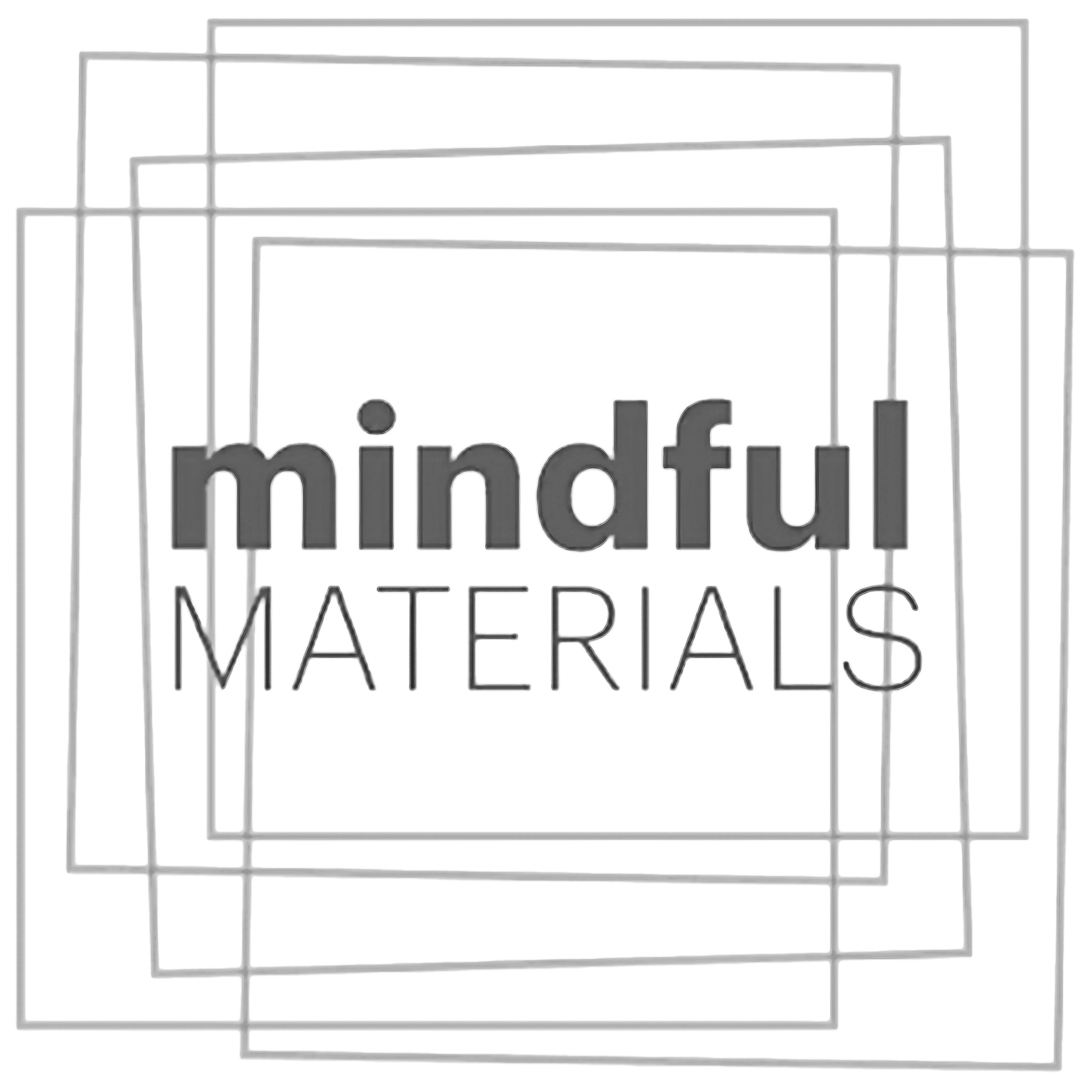 Close-up of a transparent printed circuit board with the words 'mindful materials' and some logos visible.