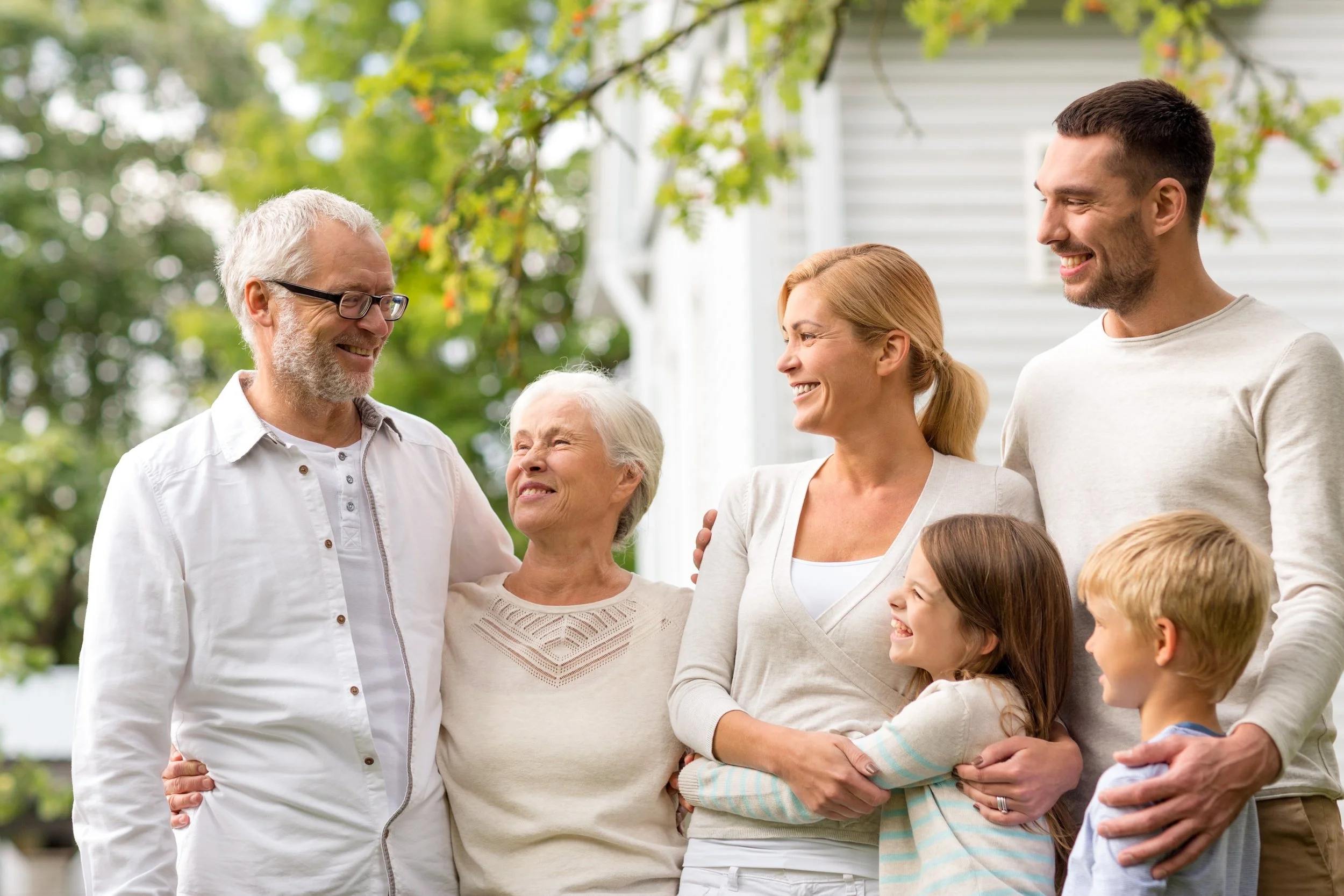 Three generations of a family spending time together outdoors, reflecting how family history can influence health while recognizing that individual risk is shaped by many factors.