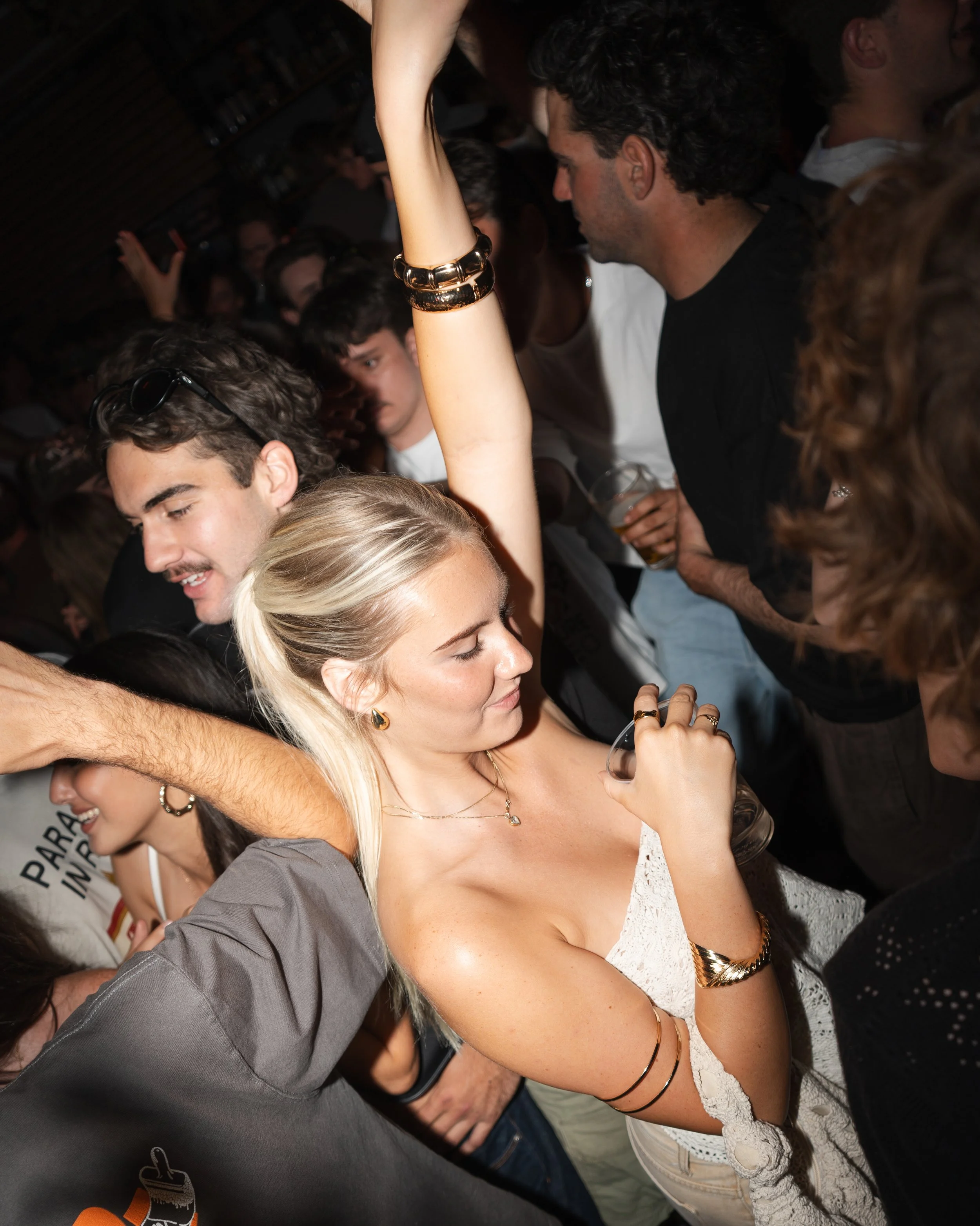 Event photography of people dancing and socializing at a nightclub in Noosa, Sunshine Coast