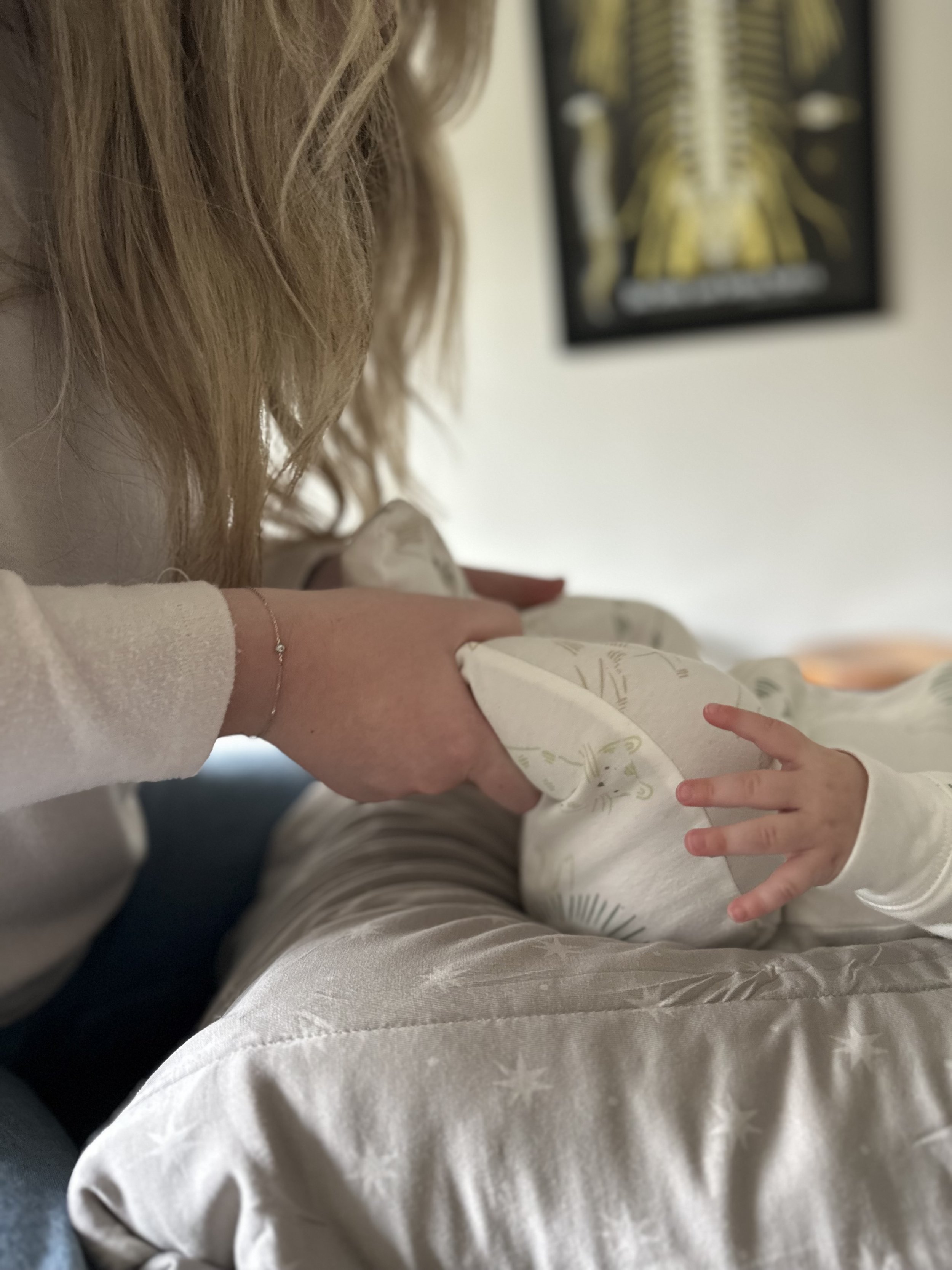 Dr. Lexi Leto performing a gentle chiropractic adjustment for a baby in Batavia, NY